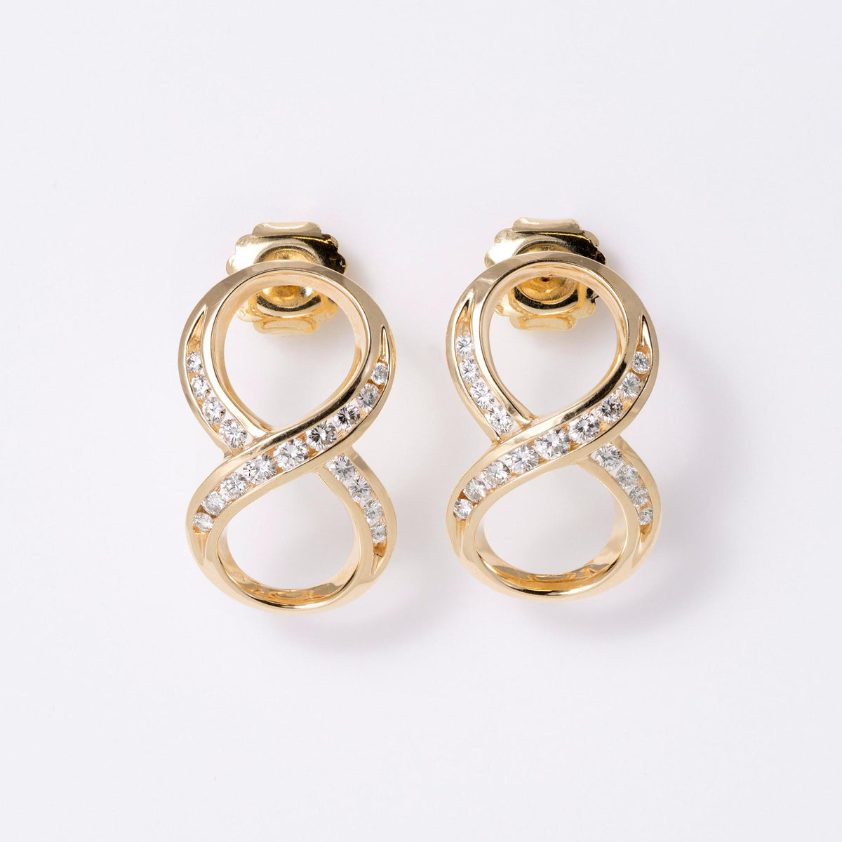 1980s Mid-Mod Bold 14k Yellow Gold Diamond Infinity Earrings