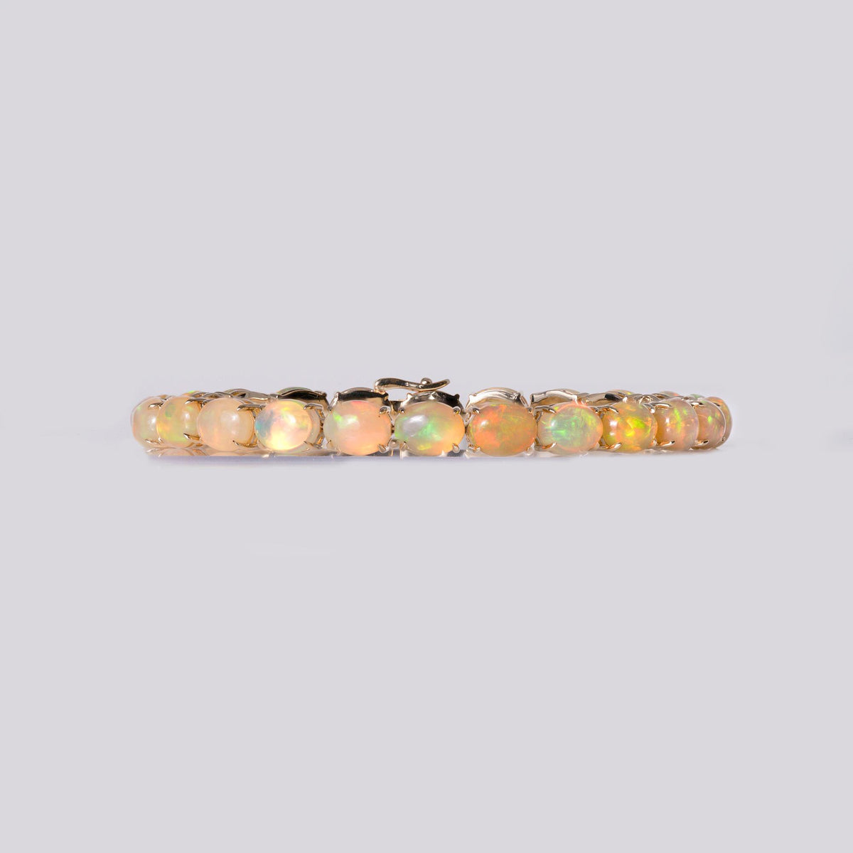 Fiery 20 Carat Opal Tennis Bracelet 14 Karat Yellow Gold