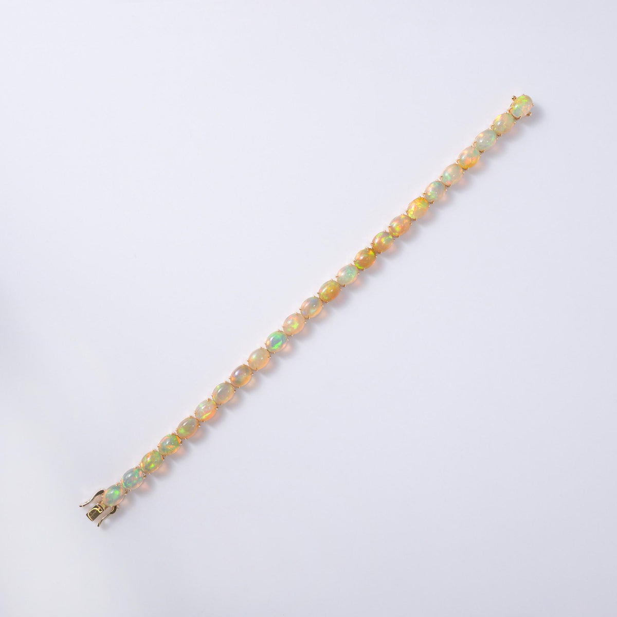 Fiery 20 Carat Opal Tennis Bracelet 14 Karat Yellow Gold