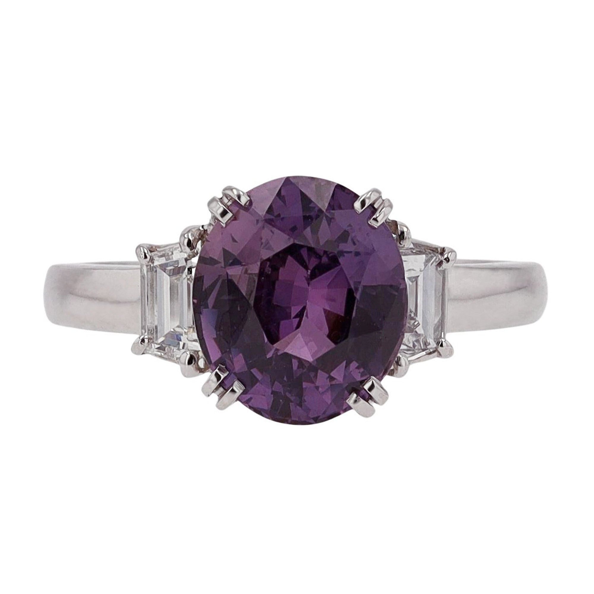 Three carat oval purple sapphire diamond 3 stone engagement ring.