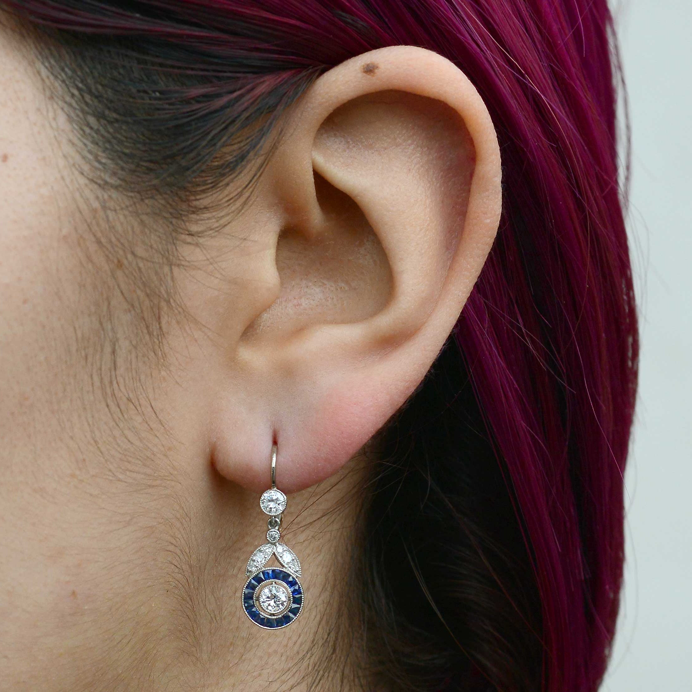 These dangle earrings really capture the light with brilliant, sparkling old cut diamonds.