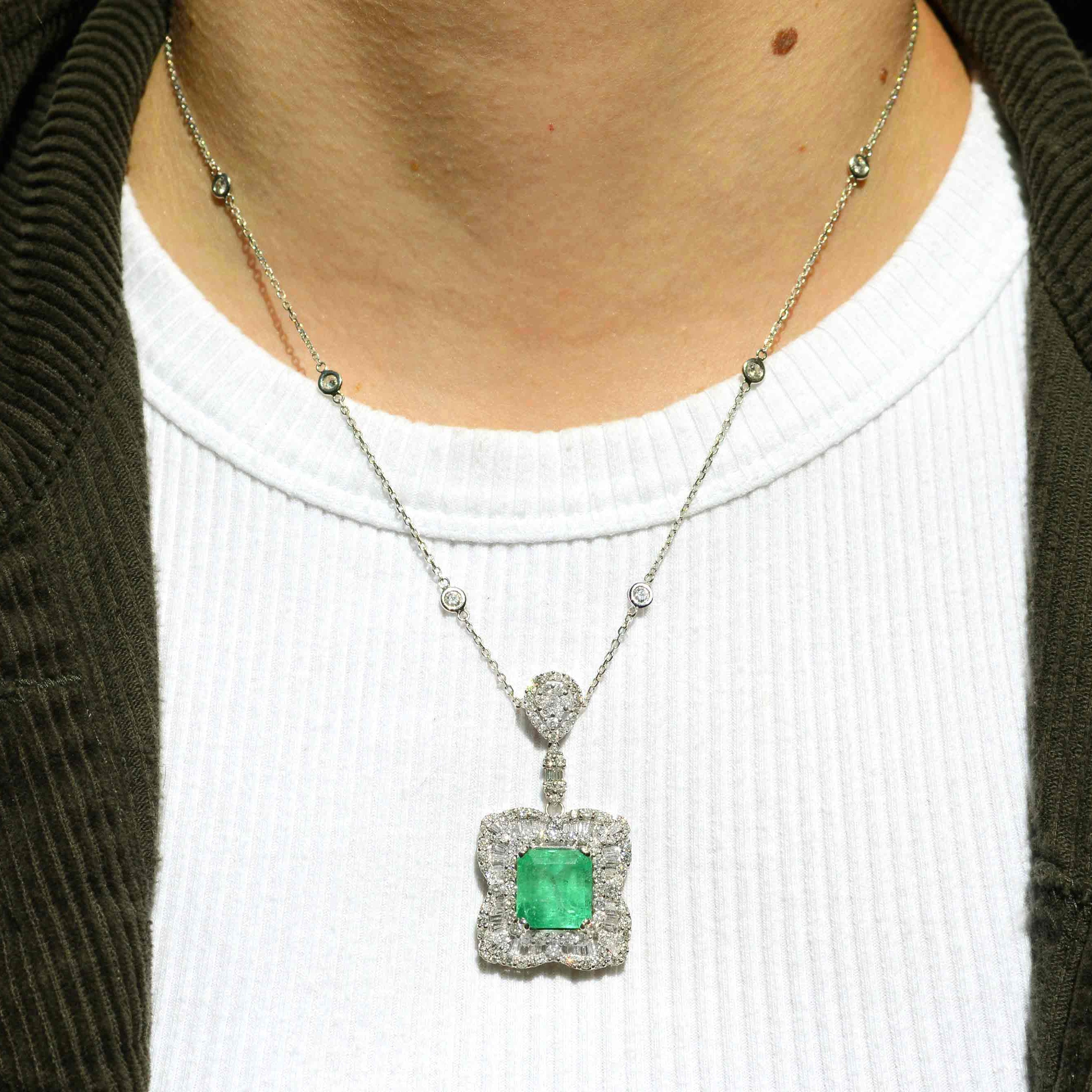 A vivid, grass green 7.90 carat emerald necklace with 3 carats of diamonds.