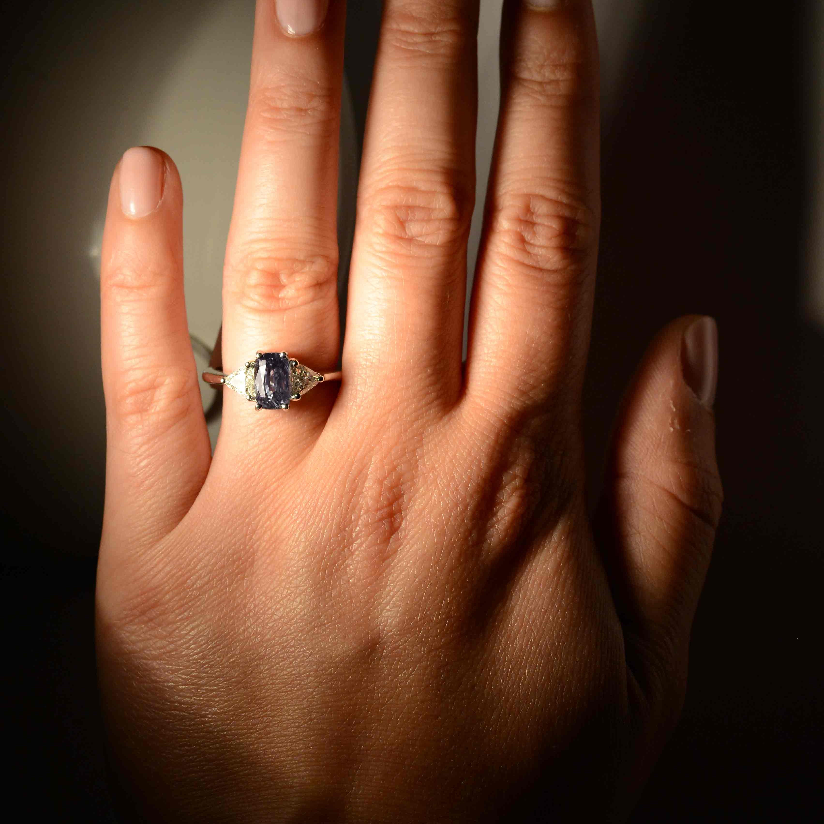 This gem has a strong, noticeable color shift from green to purplish as indicated in the GIA report.