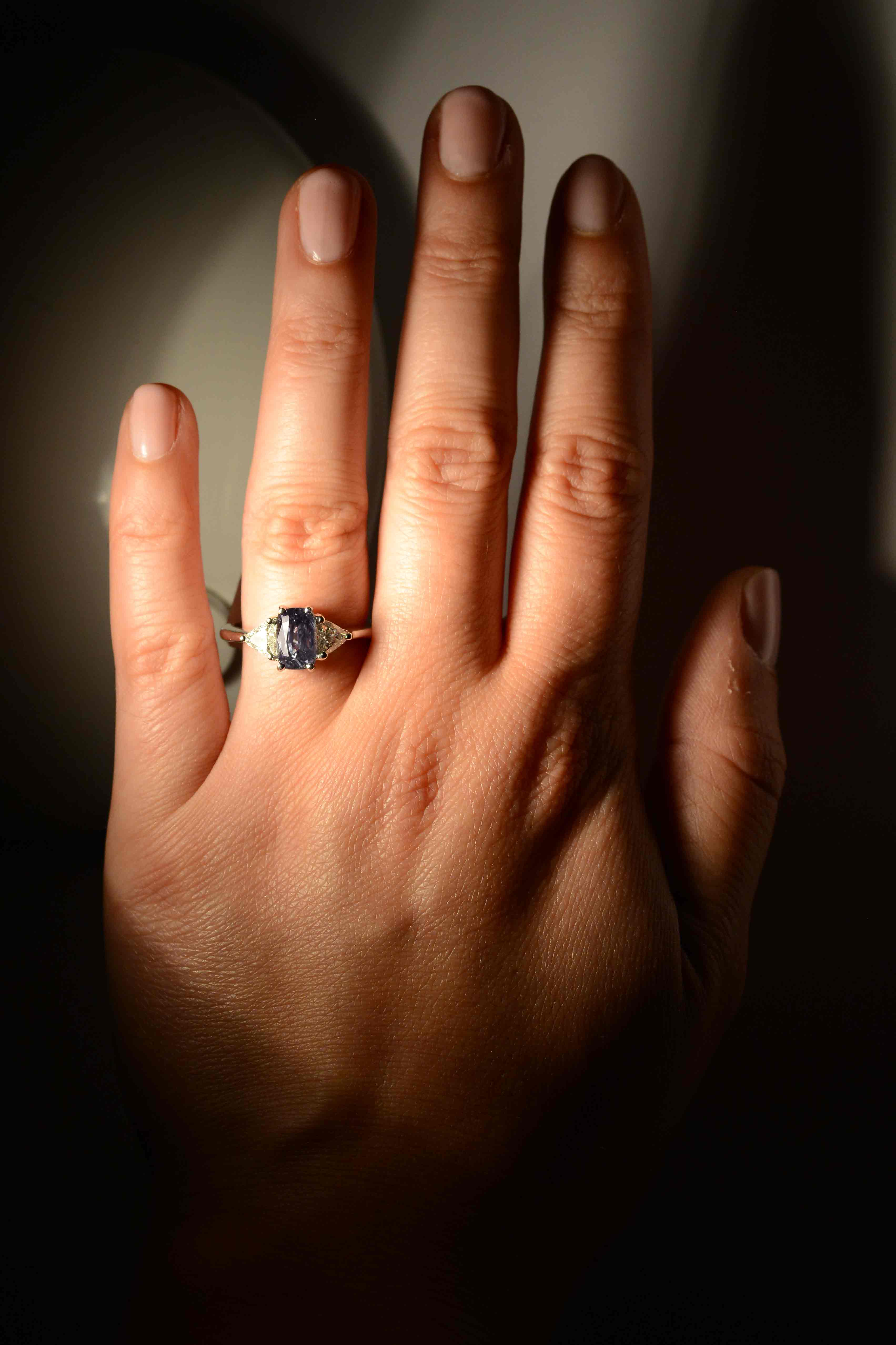 This gem has a strong, noticeable color shift from green to purplish as indicated in the GIA report.