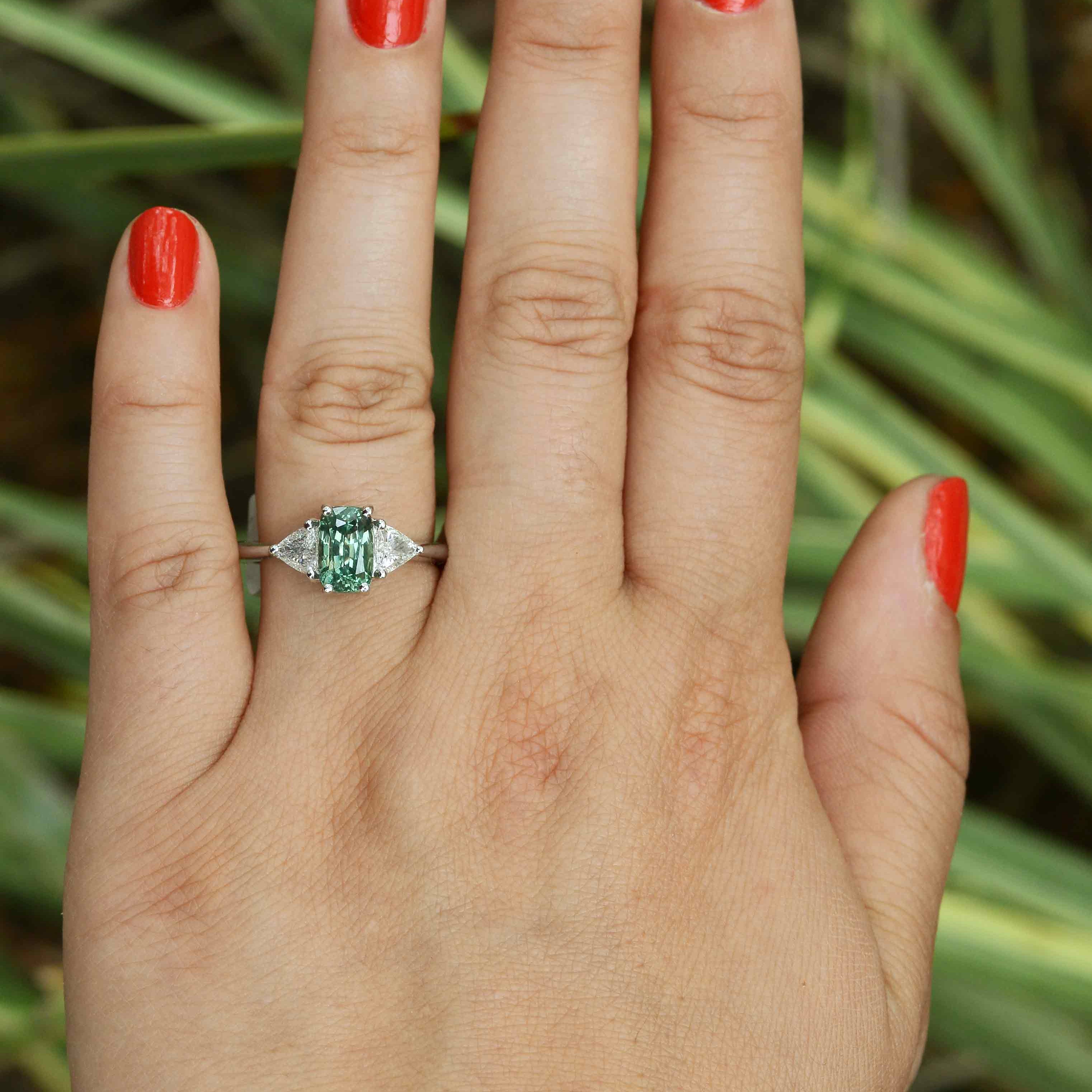 A newly made, contemporary style alexandrite ring with 2 trillion cut diamonds.