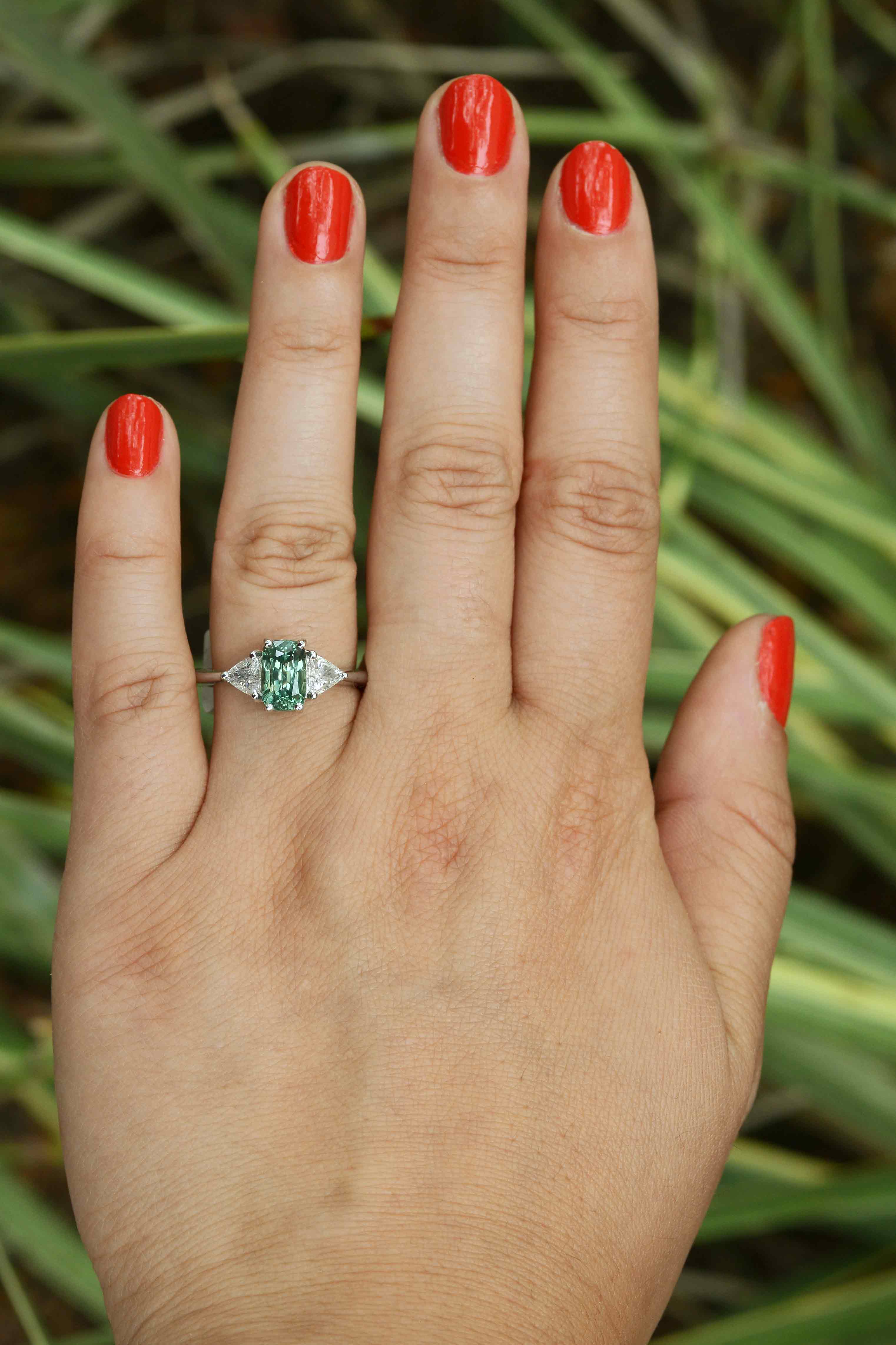 A newly made, contemporary style alexandrite ring with 2 trillion cut diamonds.