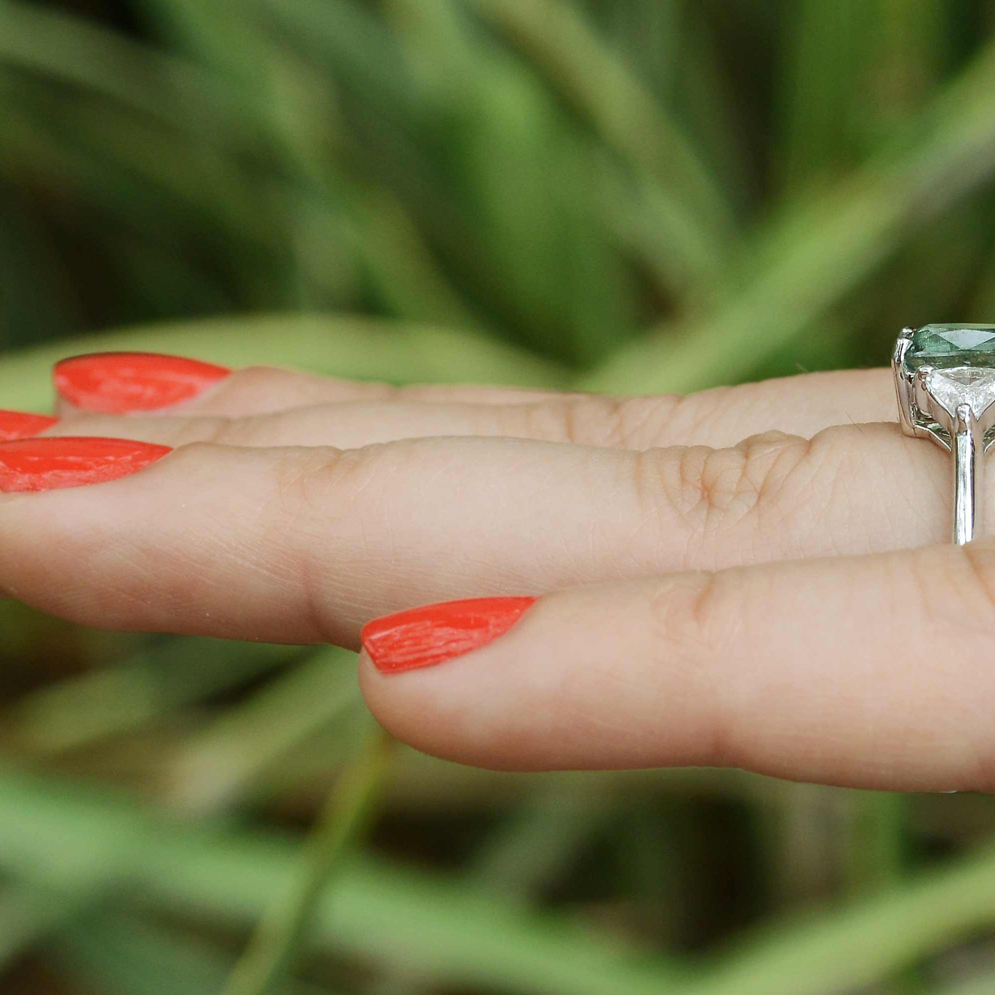 There is nearly a half carat of trillion cut accent diamonds in this 14k white gold alexandrite bridal ring.