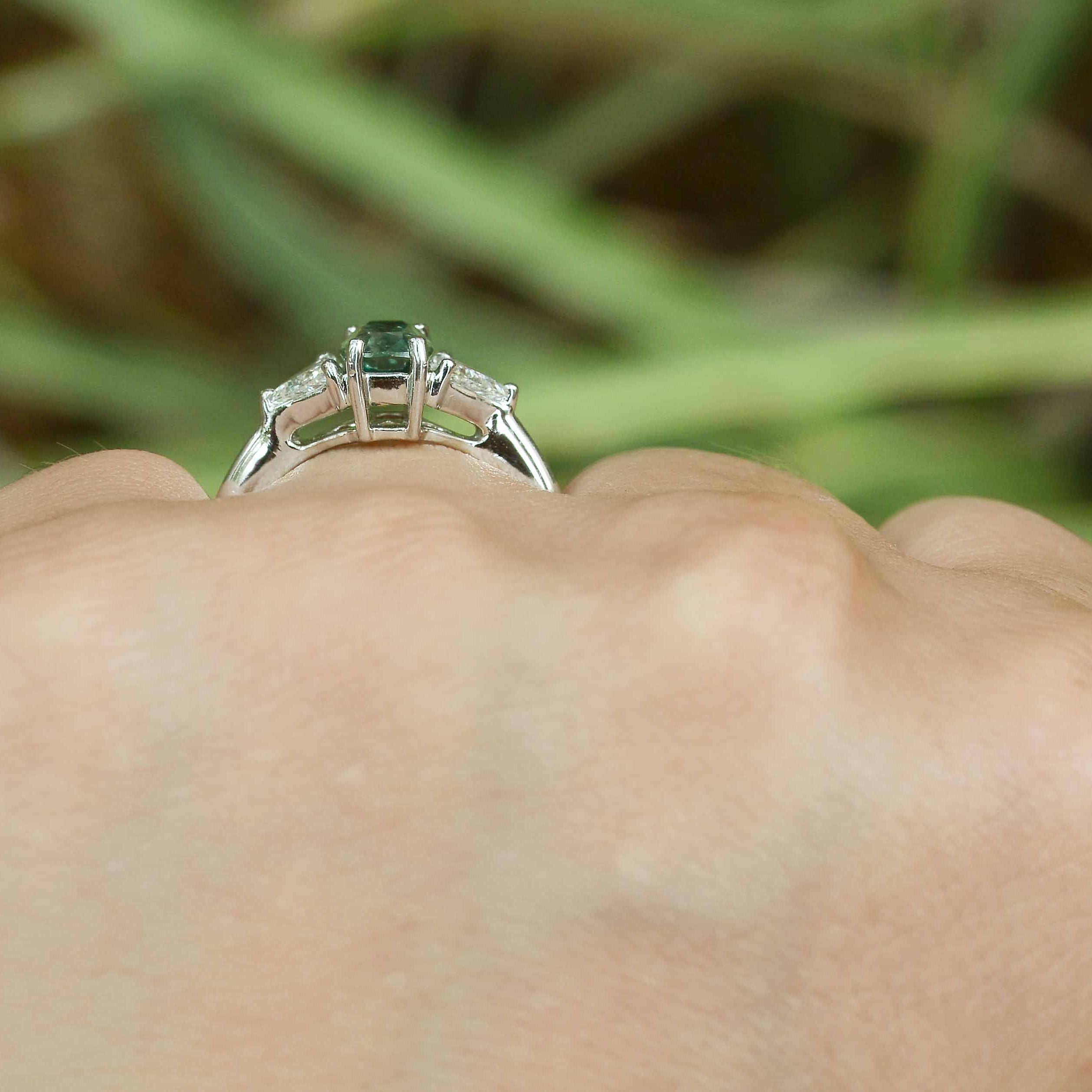 A two carat alexandrite, three stone diamond engagement ring.