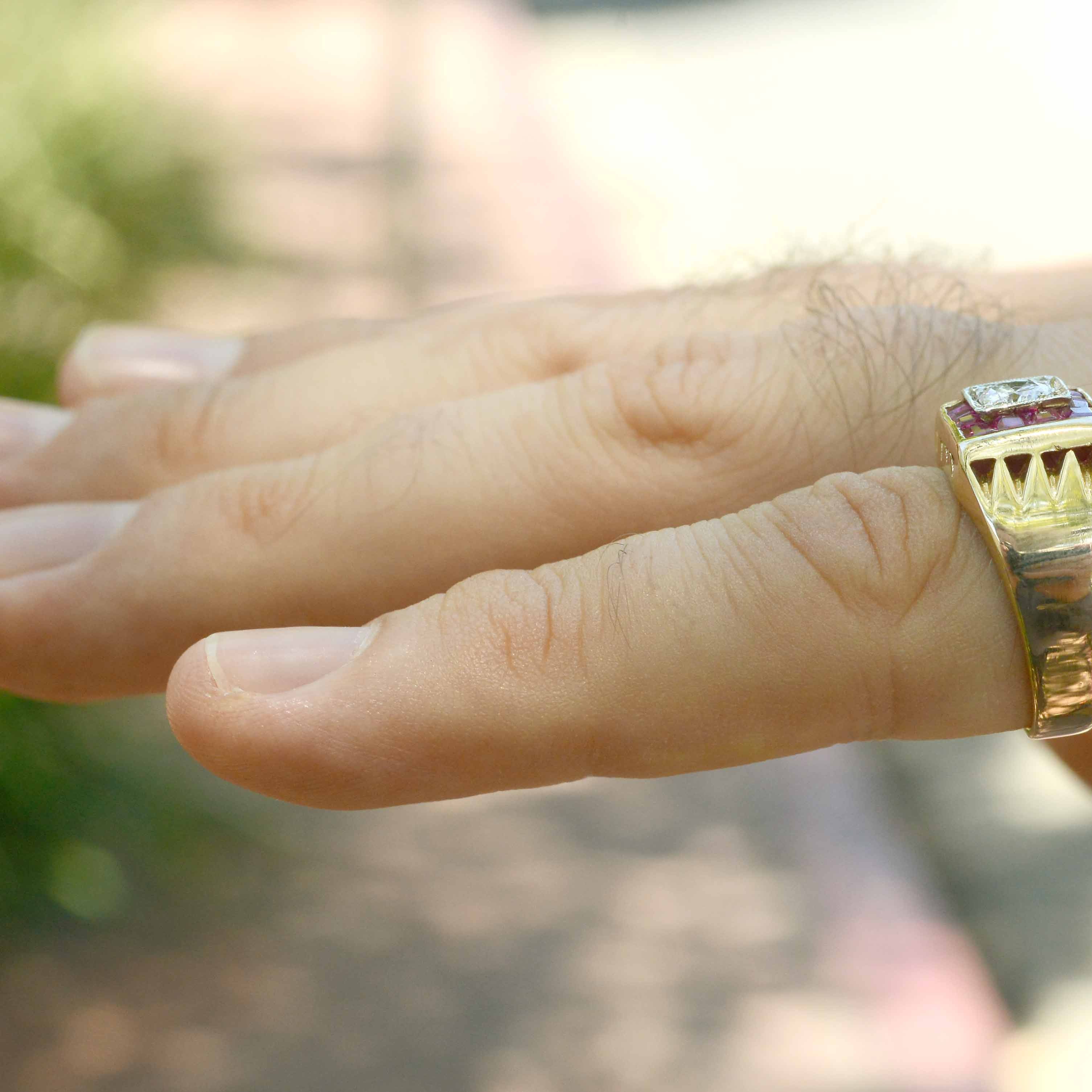 A 2 tone yellow & white gold unisex diamond band with rubies.