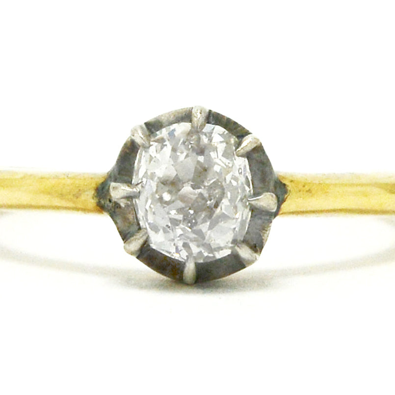 A silver and yellow gold Georgian style diamond solitaire ring.