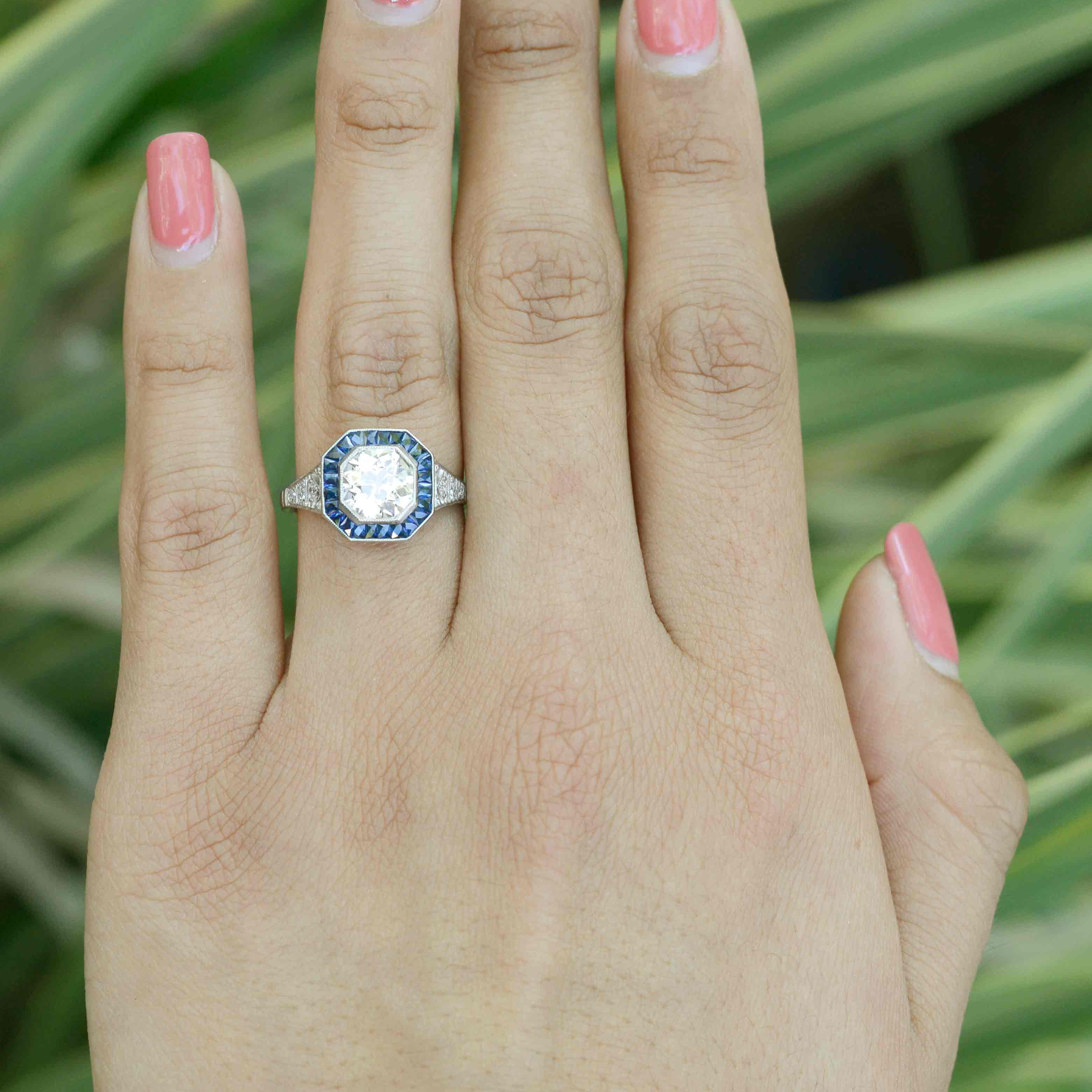 A one and a half carat diamond octagon engagement ring with sapphires.