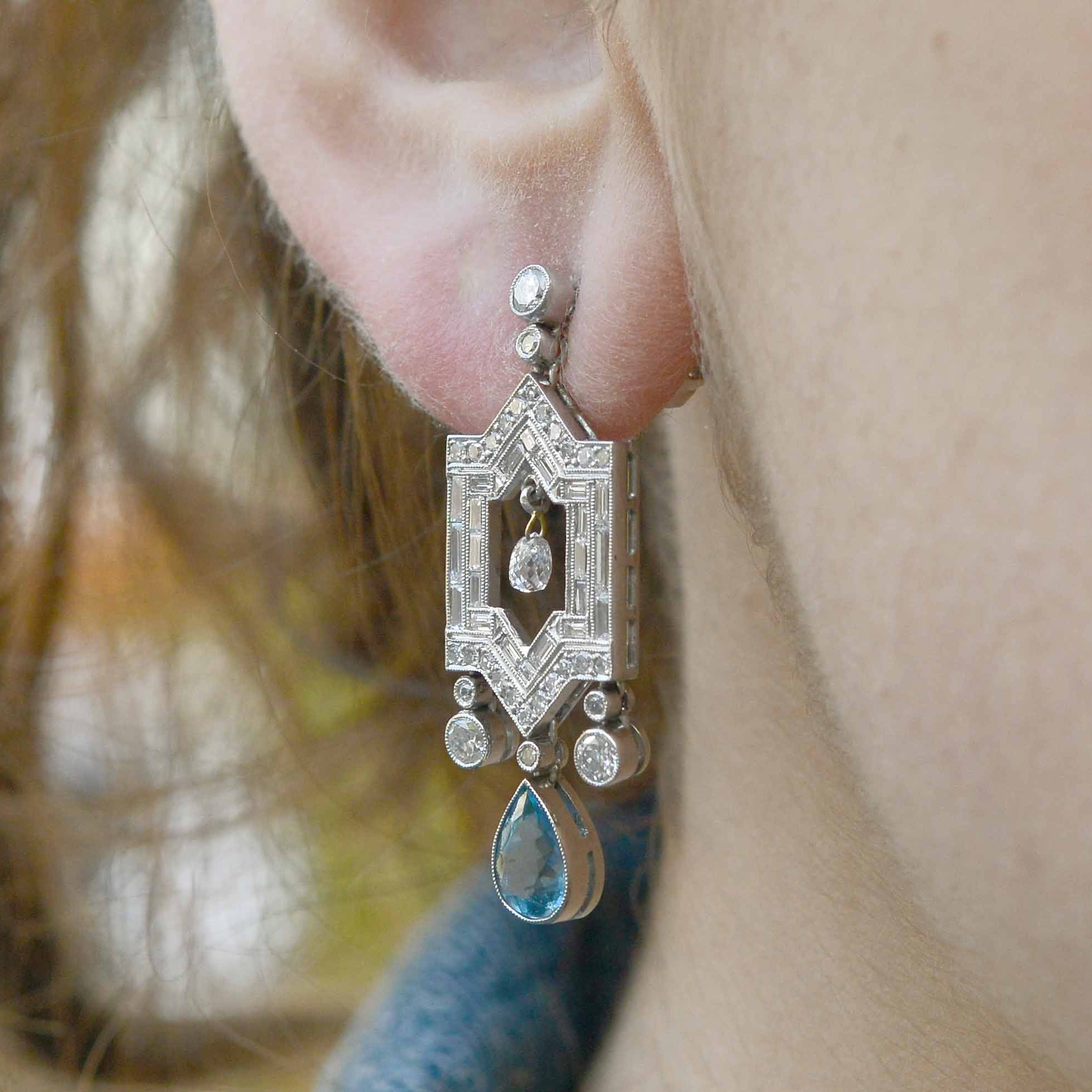 Aquamarine diamond architectural design with sharp edges and extravagant ornamentation.