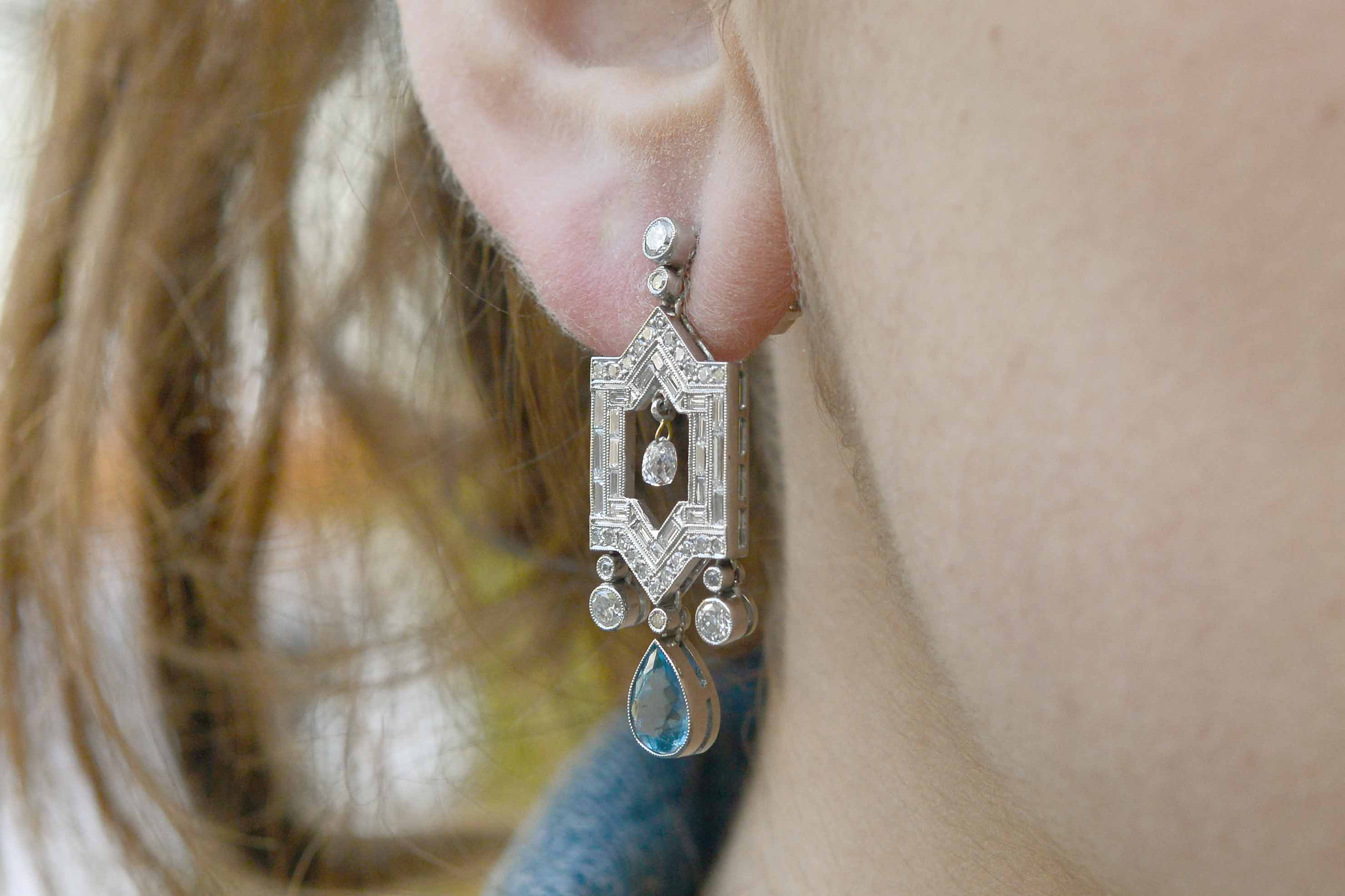 Aquamarine diamond architectural design with sharp edges and extravagant ornamentation.