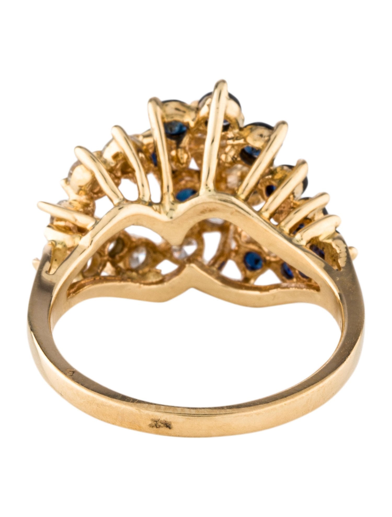 A unique 14k gold cluster ring with diamonds and sapphires.