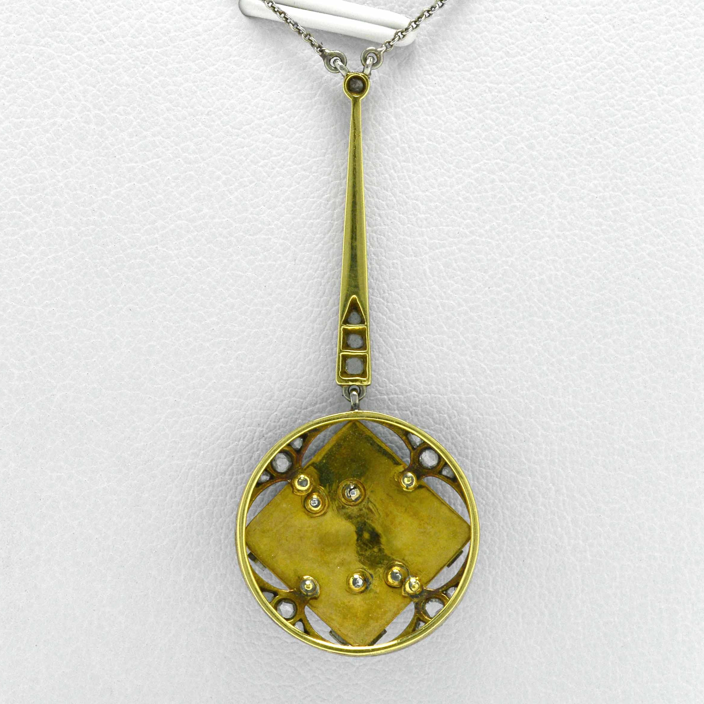 A gold back and platinum top Edwardian antique pendant necklace.
