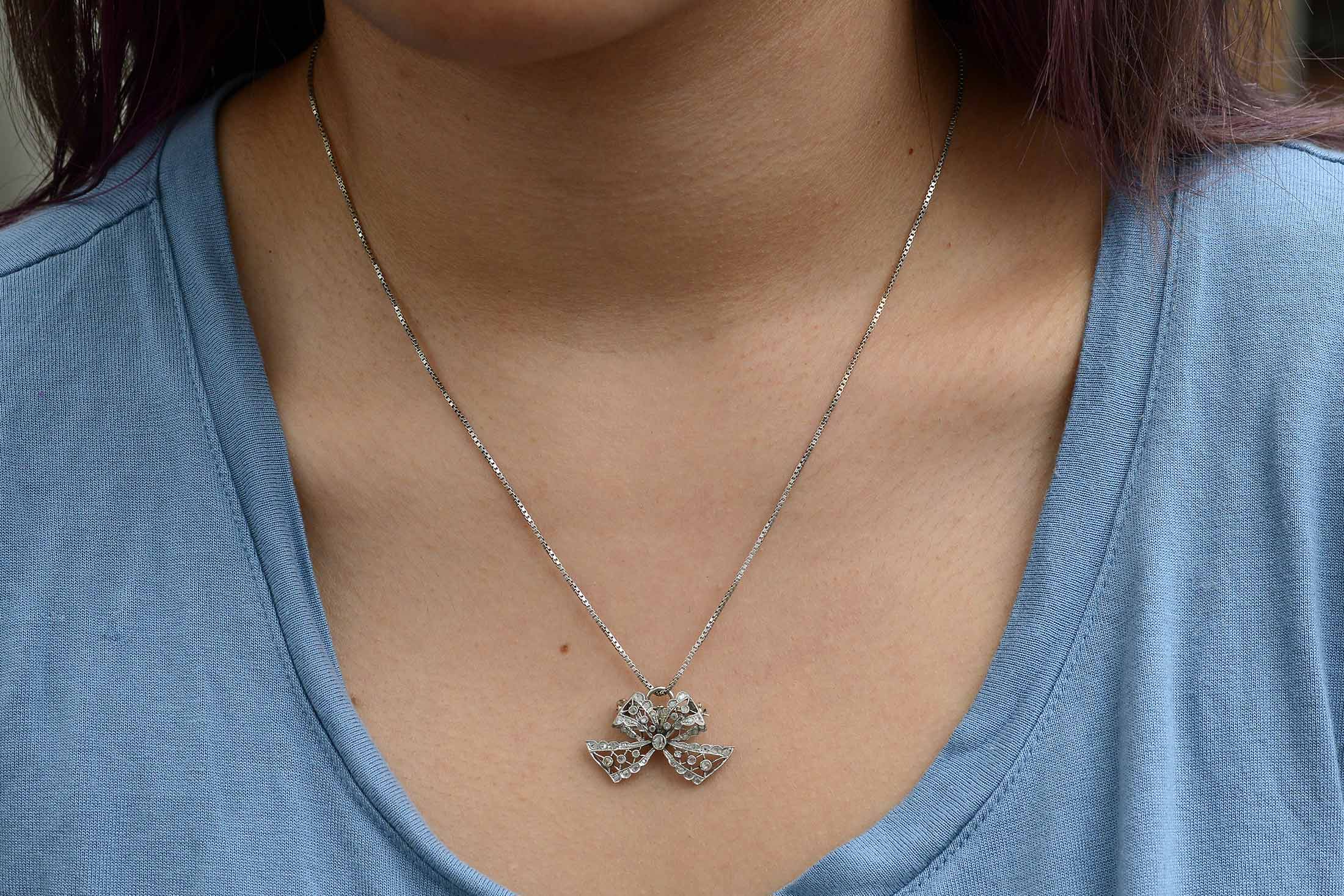 Rose and table cut diamonds on an antique diamond ribbon pendant.