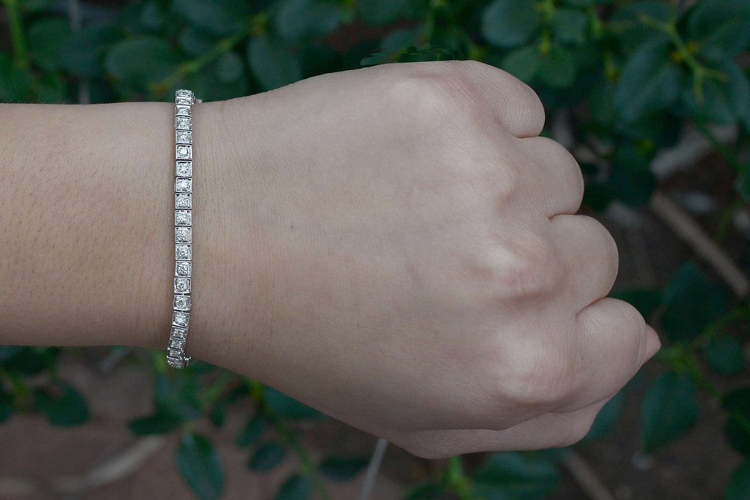 A 1940's Art Deco heirloom bracelet with a single line of diamonds expertly set.