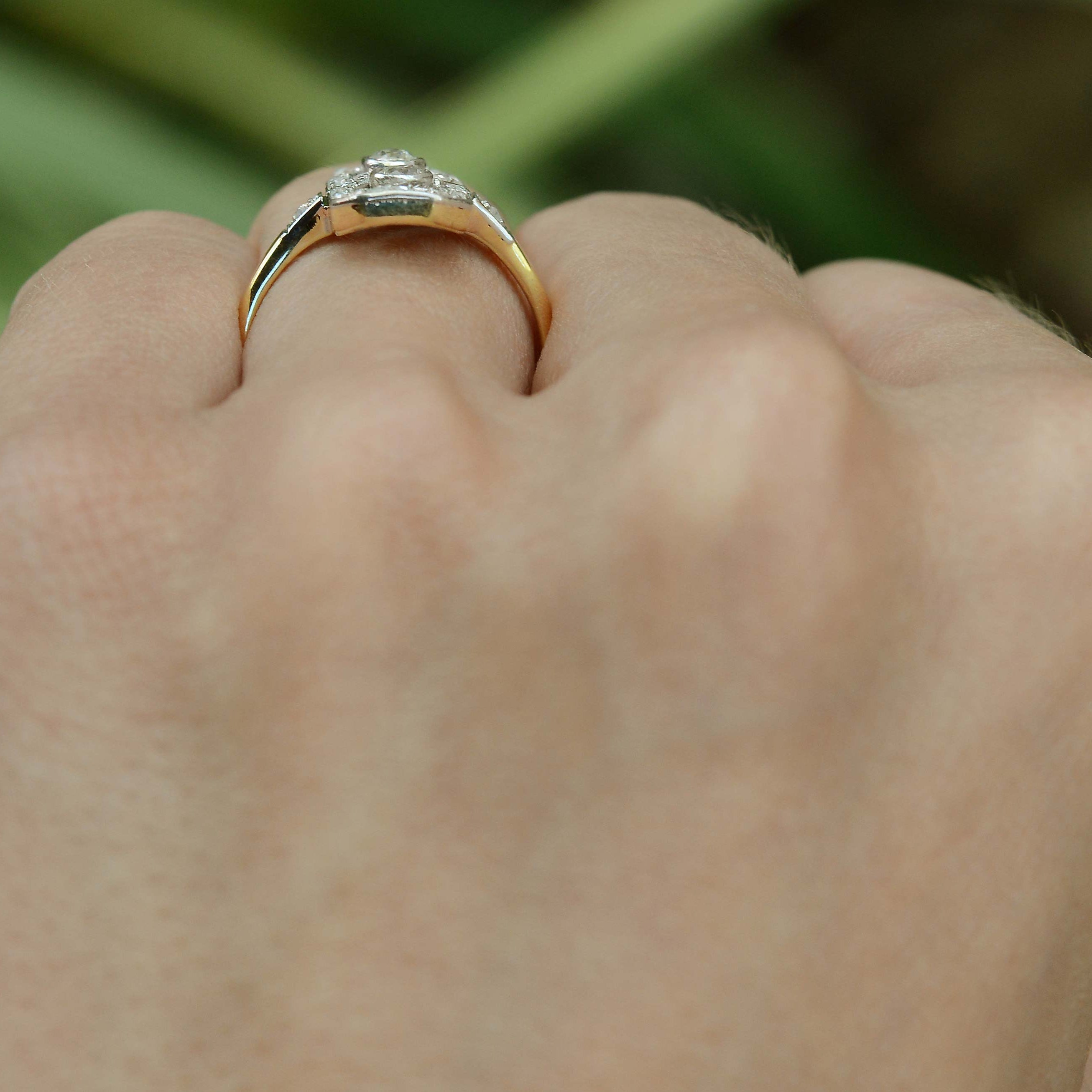 Two diamonds set in a yellow and white gold ring.