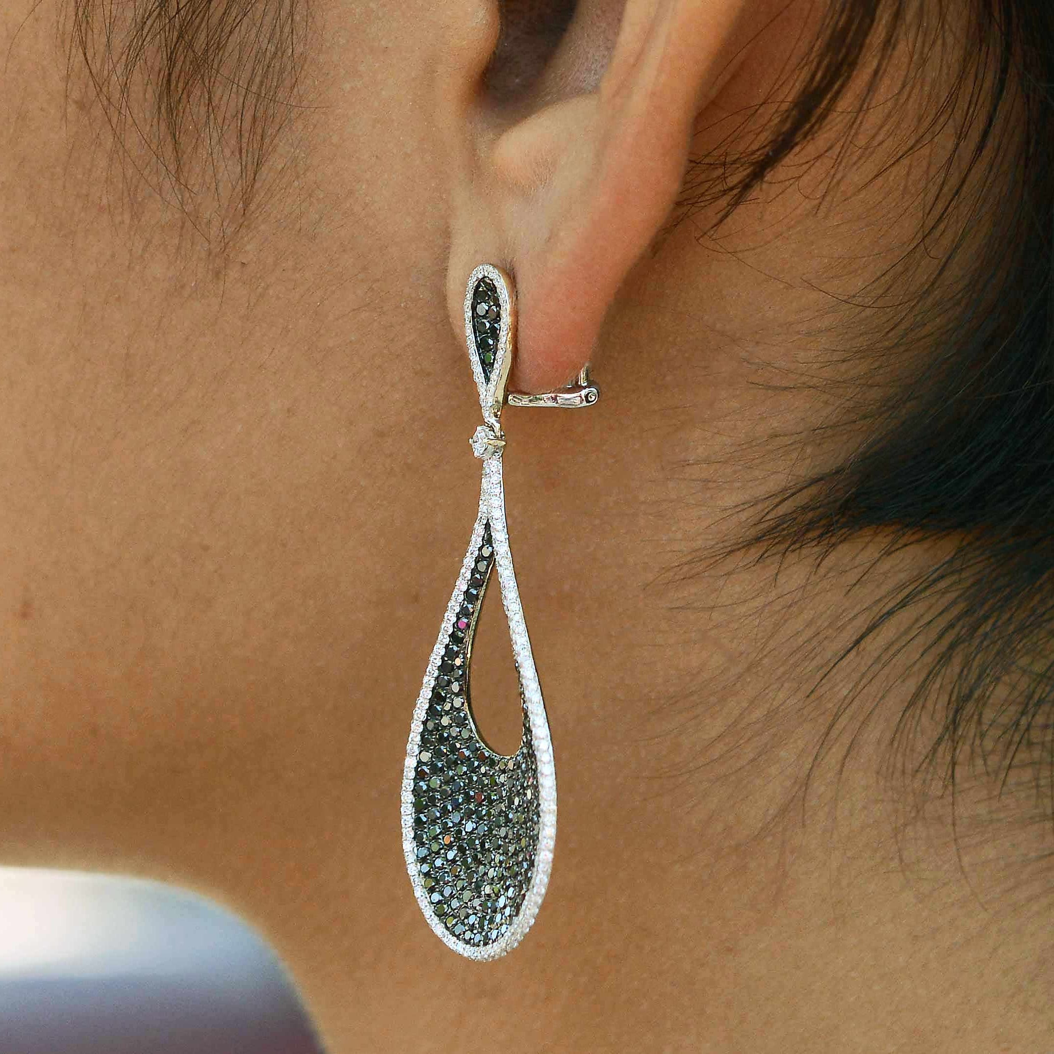 18k gold 2" long teardrop diamond earrings.