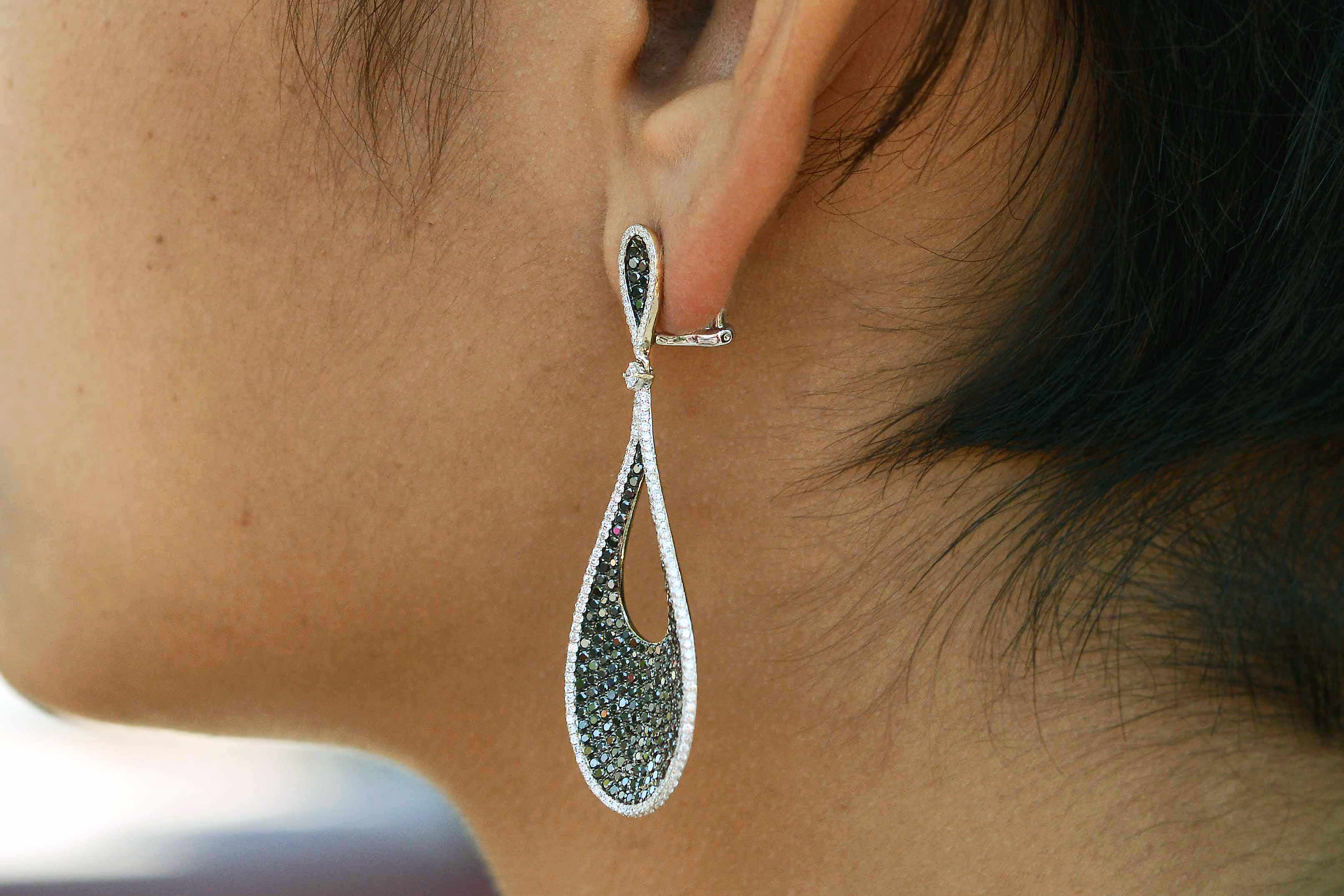 18k gold 2" long teardrop diamond earrings.