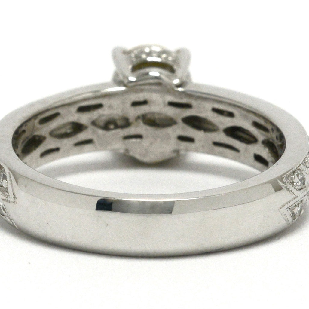 This diamonds and sapphire ring has 2 rows of diamonds encircling it.