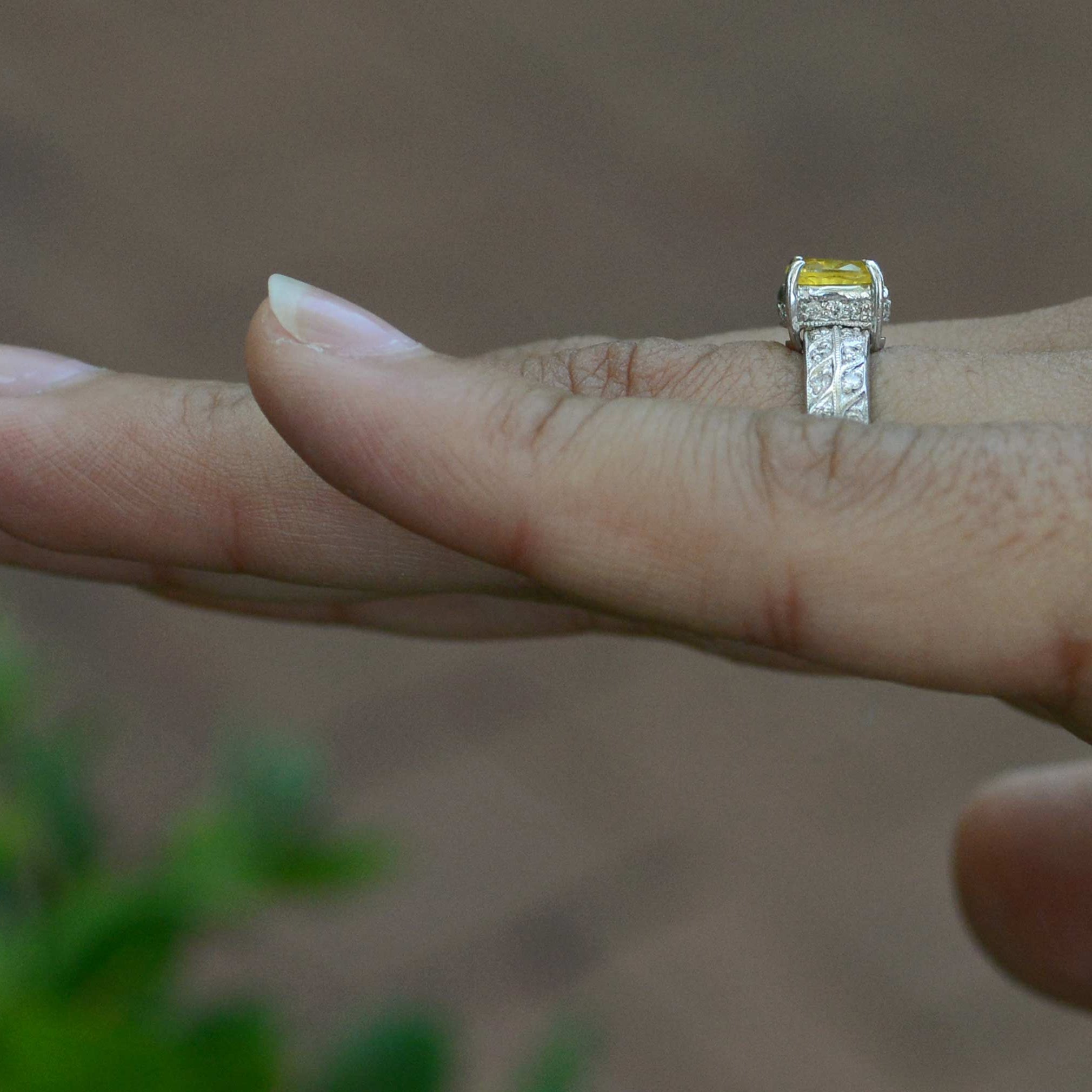 Two rows of diamonds line the straight shank of this white gold engagement ring.