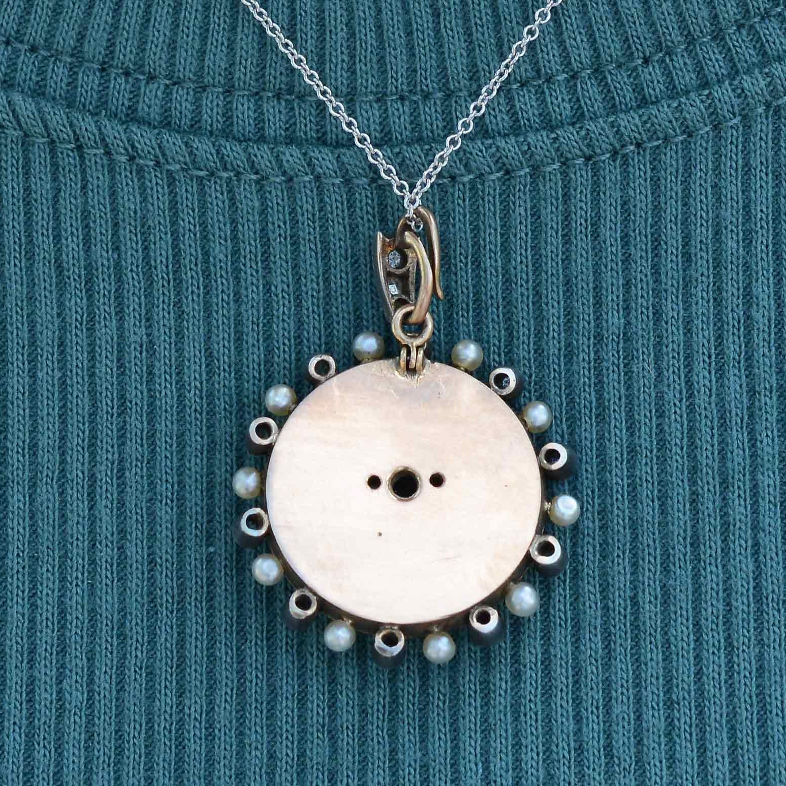 The backside of this pendant necklace is 14k rose gold.