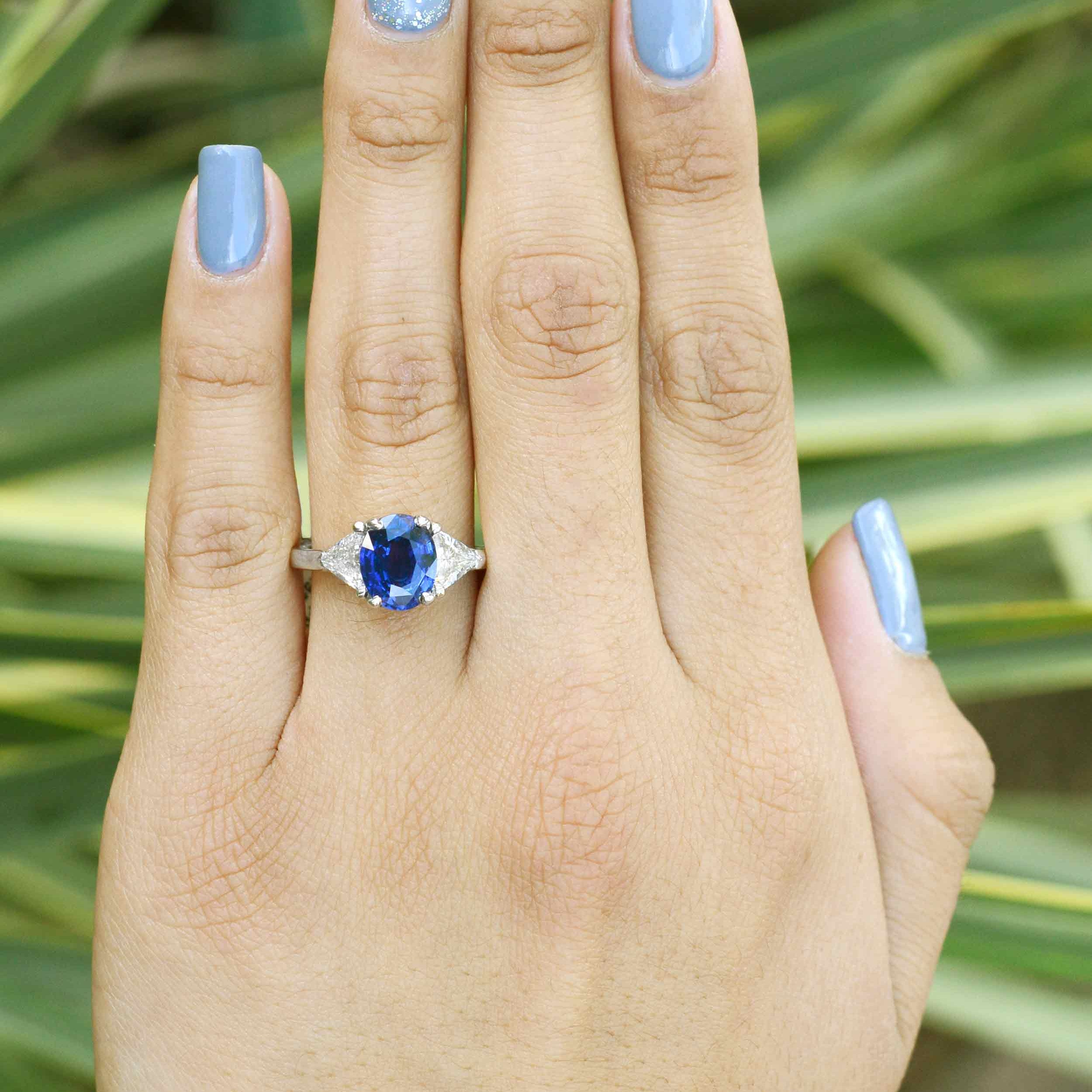 A size 6.75 diamond and blue sapphire 3 stone ring.