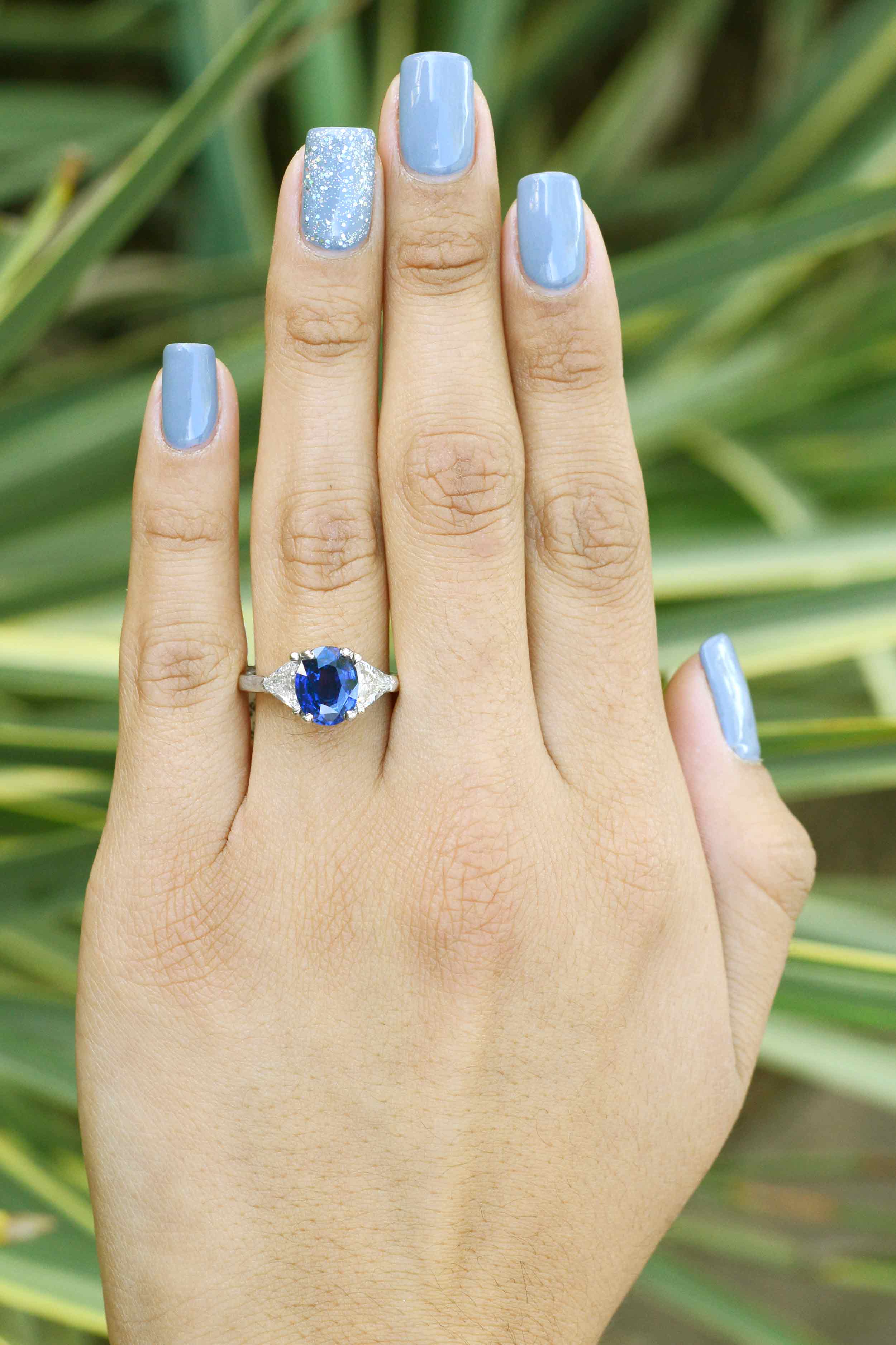 A size 6.75 diamond and blue sapphire 3 stone ring.