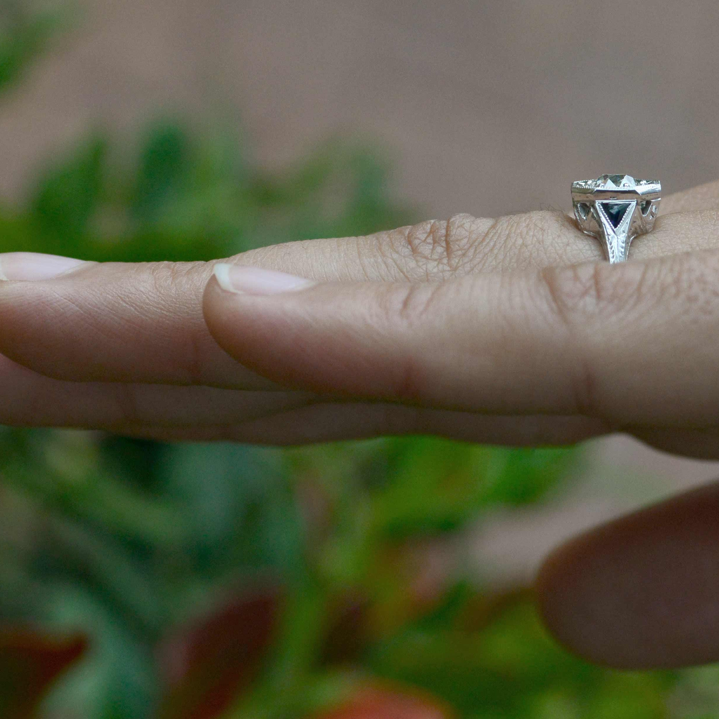 A three stone design Art Deco engagement ring.