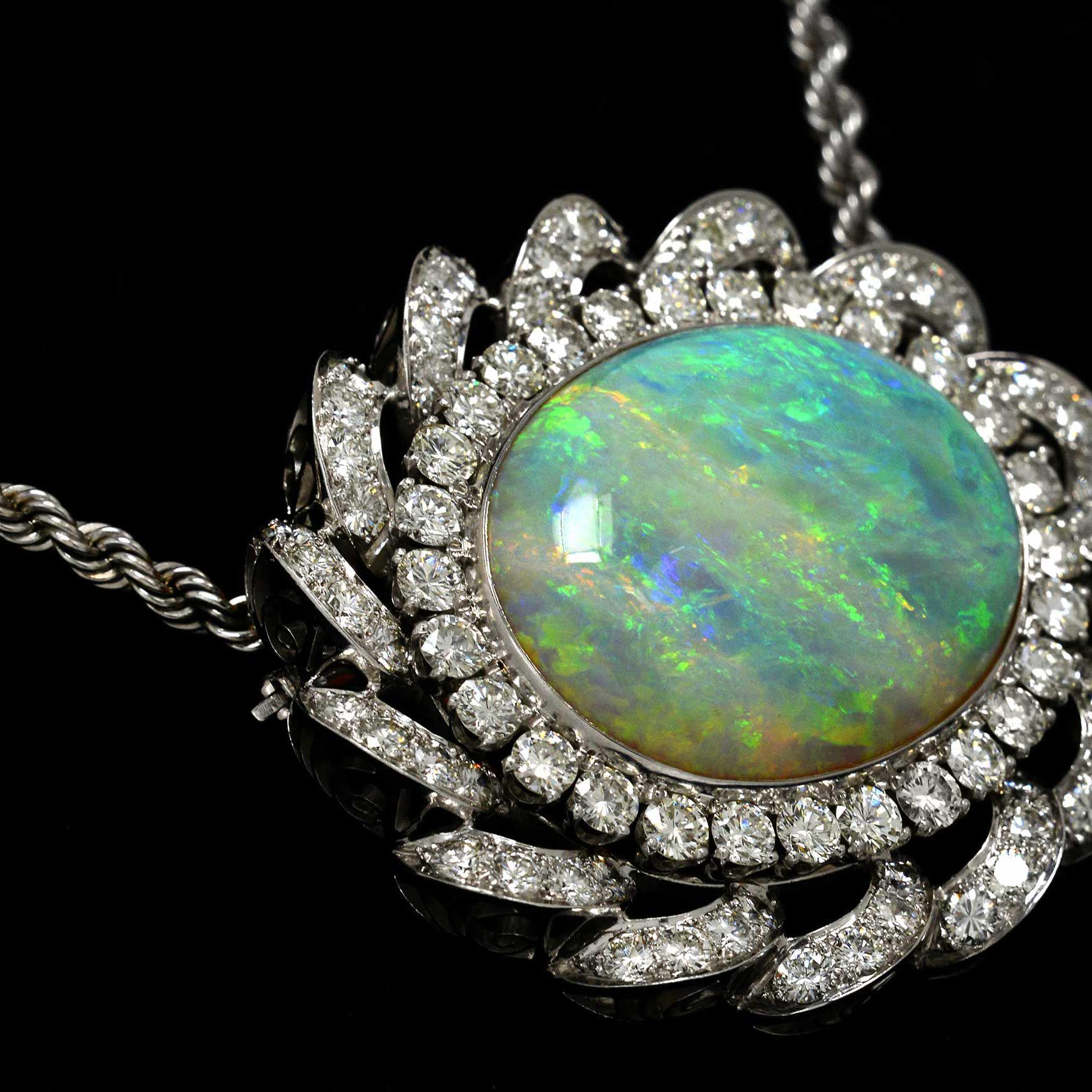 A 30 carat oval cabochon cut opal is set in nearly 10 carats of diamonds.