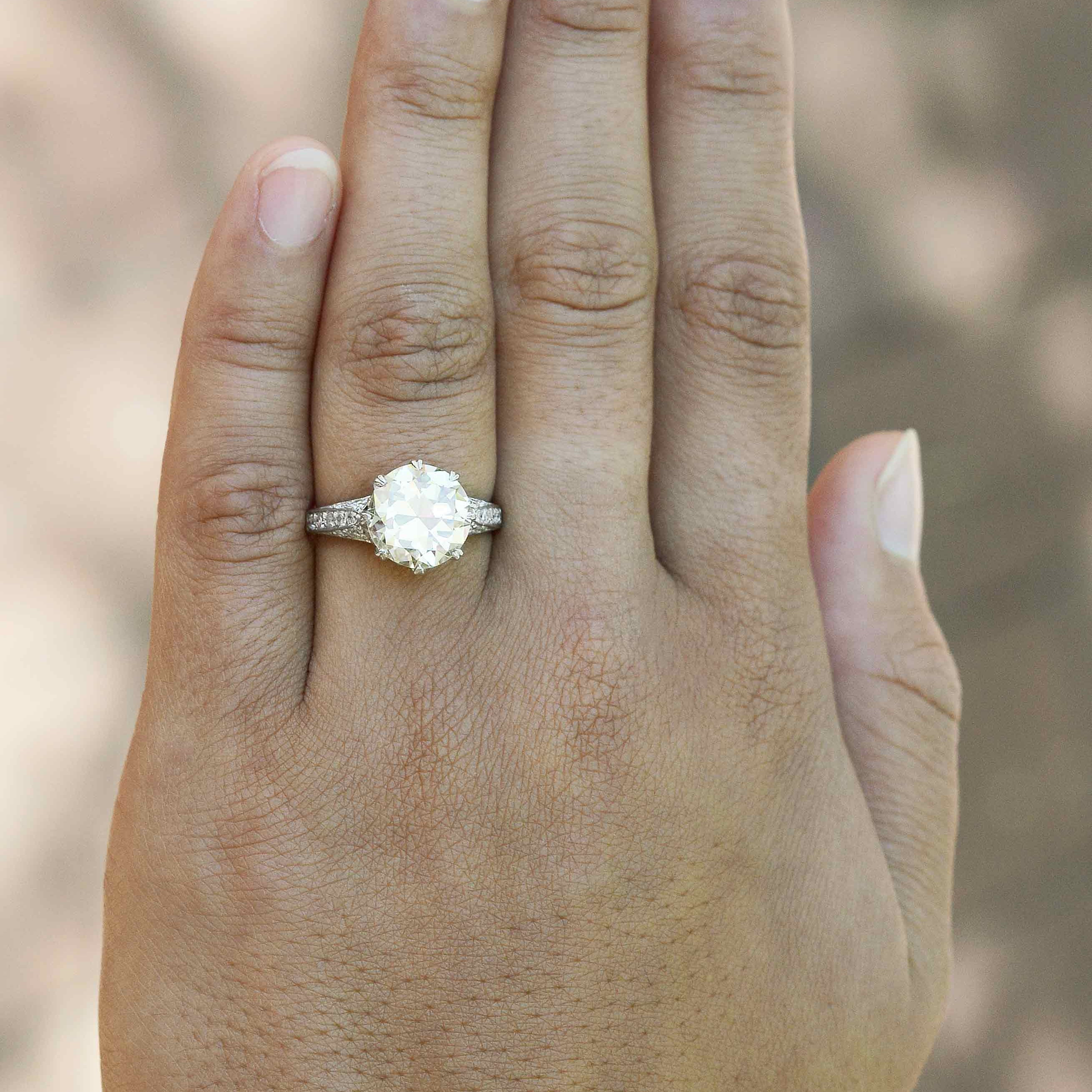 4 carat diamond solitaire with diamonds on the shank.