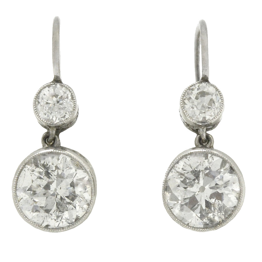 A glimmering pair of Art Deco style diamond drop earrings boasting 4.30 carats of dazzling beauty.
