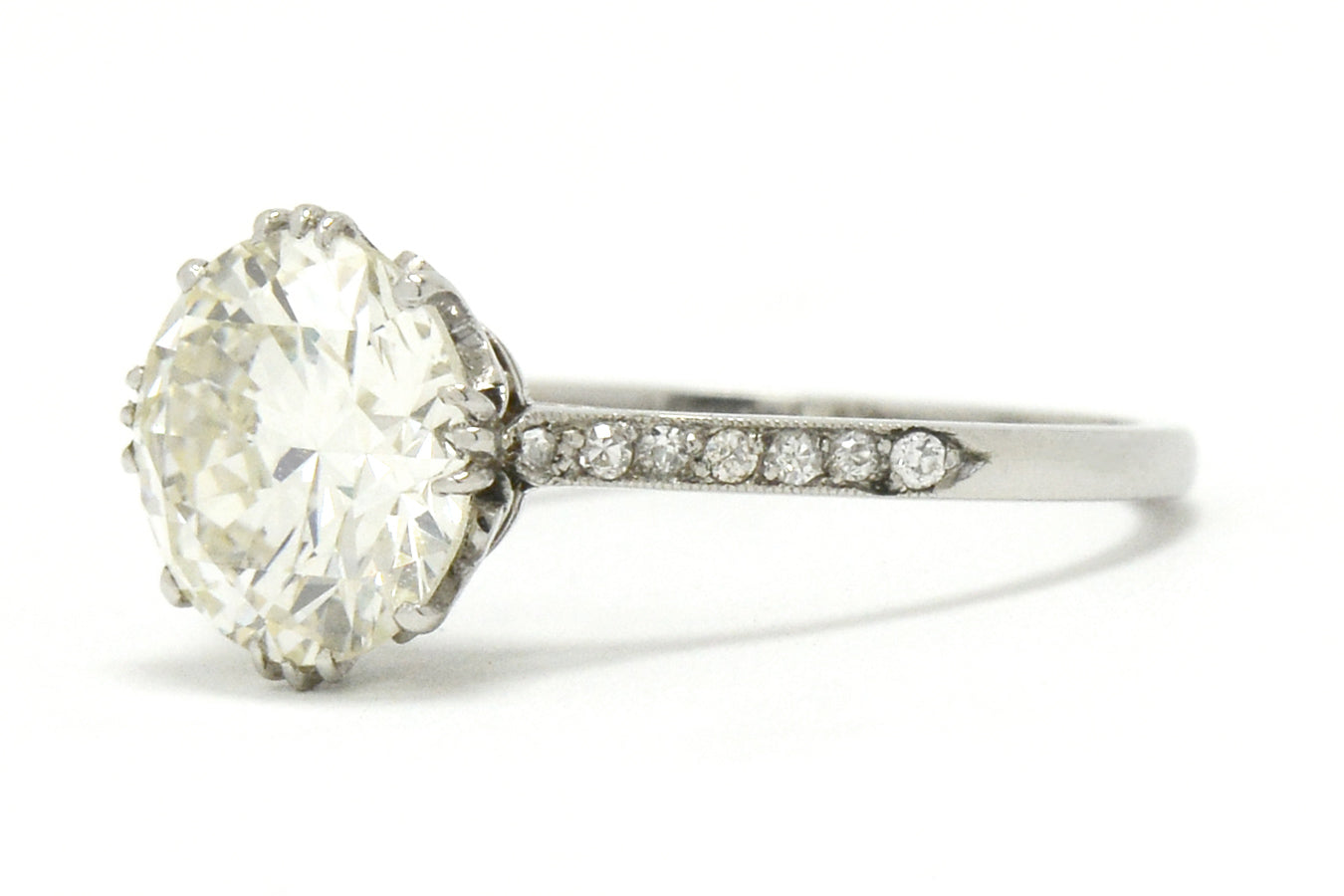 Edwardian style diamond solitaire ring secured by 4 prongs.