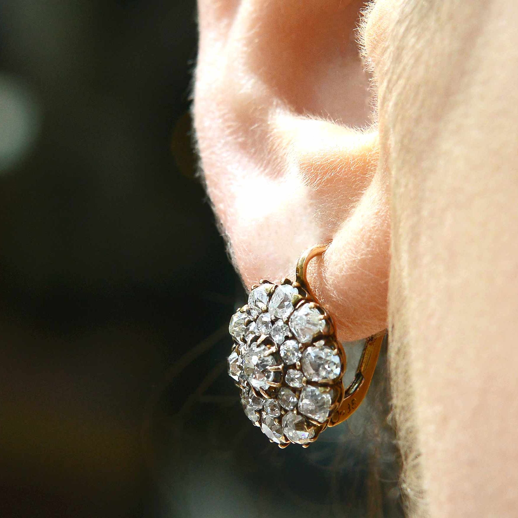 A unique double diamond halo cluster earrings design.