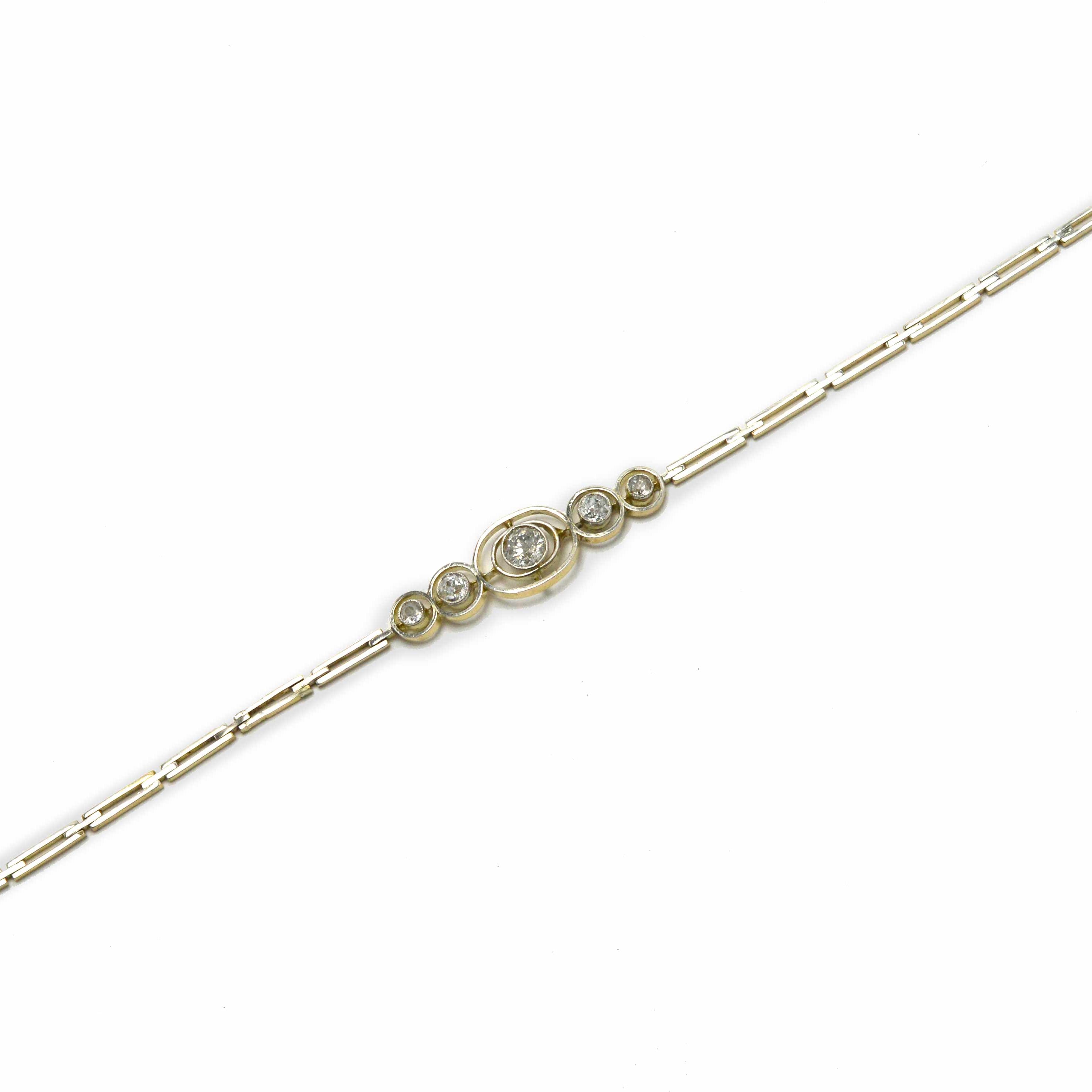 Concentric bezel settings of platinum 5 fiery hand-cut old mine diamonds are set in this bracelet.