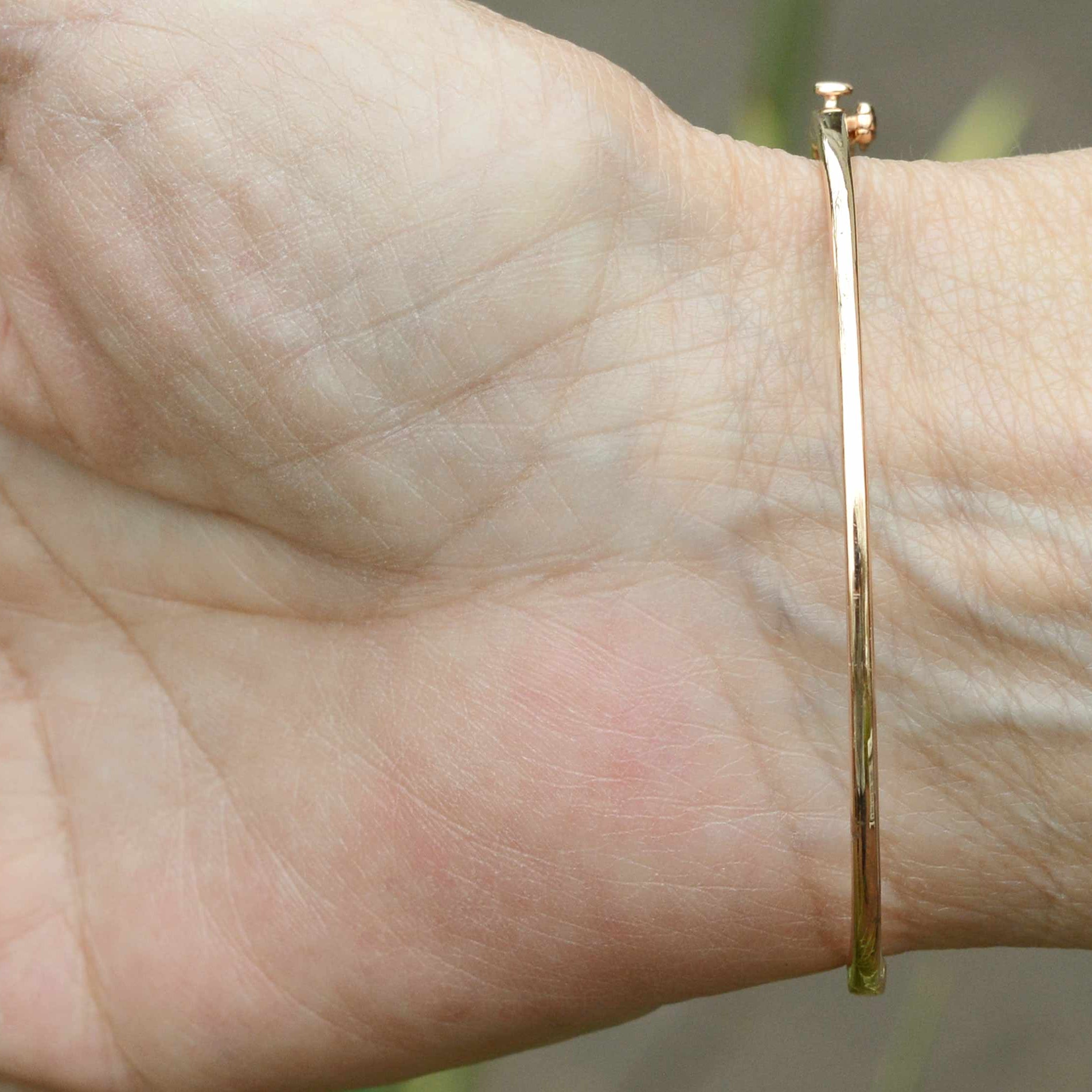 This thin bangle cuff bracelet fits a 7 inch wrist.
