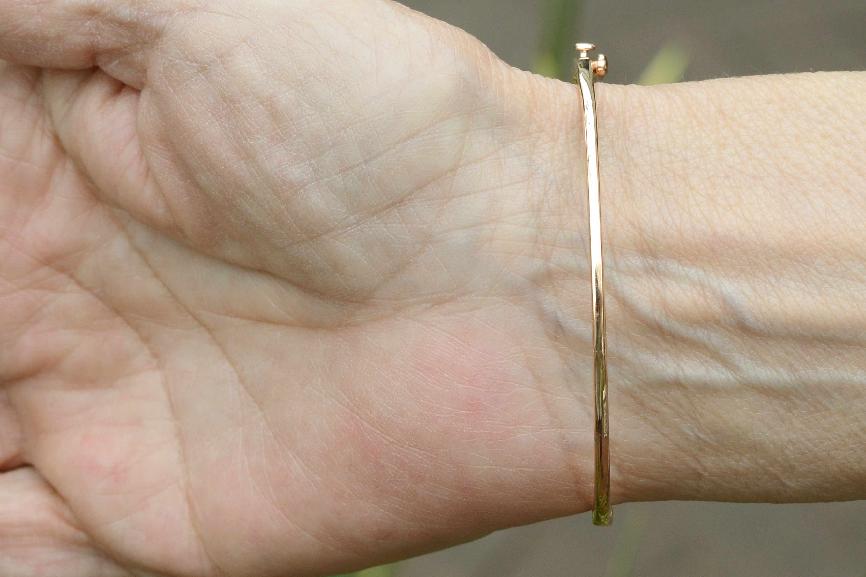 This thin bangle cuff bracelet fits a 7 inch wrist.