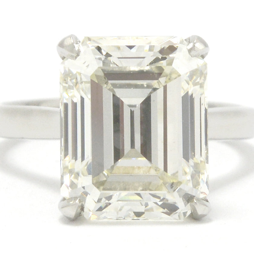 A large 8 carat emerald cut diamond solitaire engagement ring.