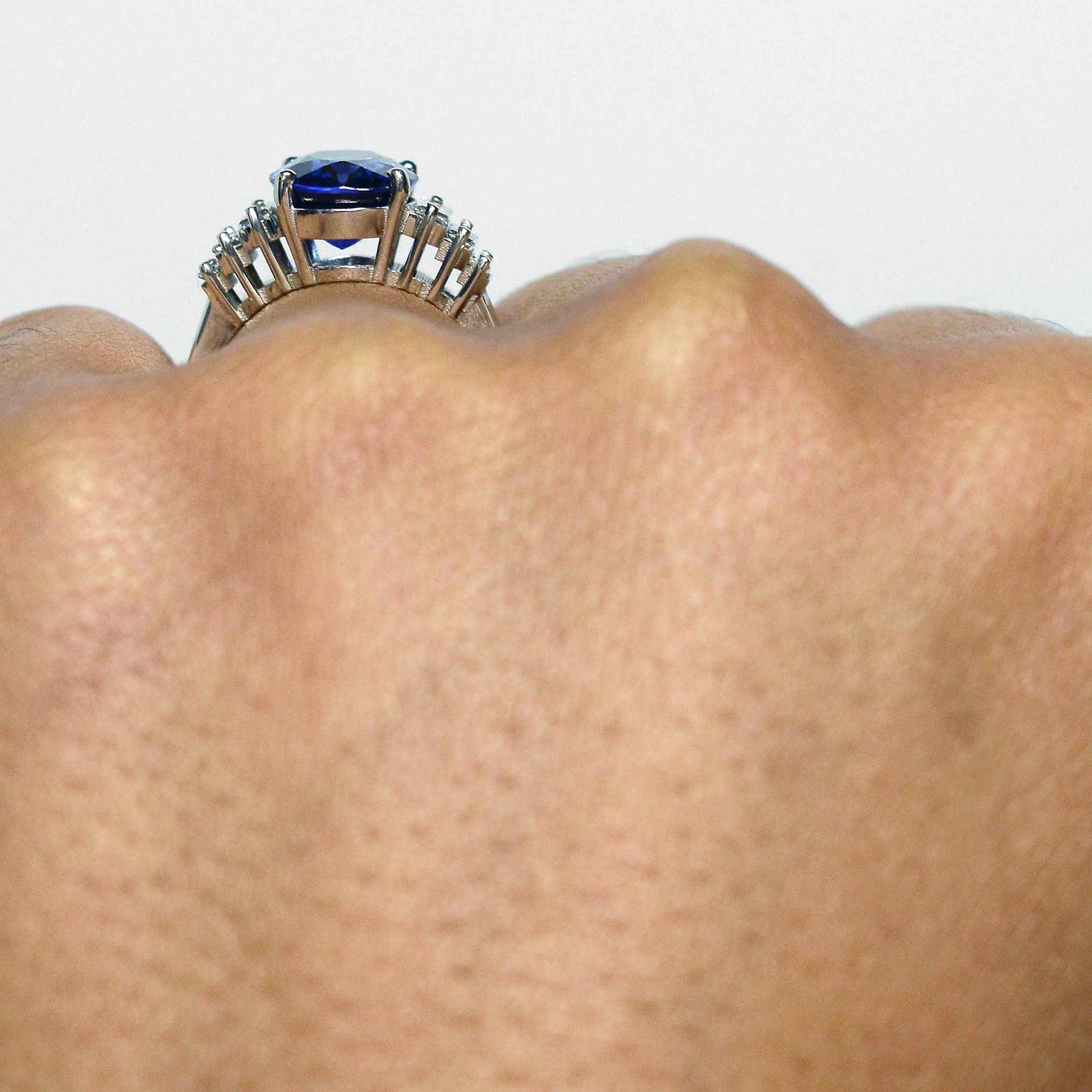 A four carat oval blue sapphire, Art Deco engagement ring.