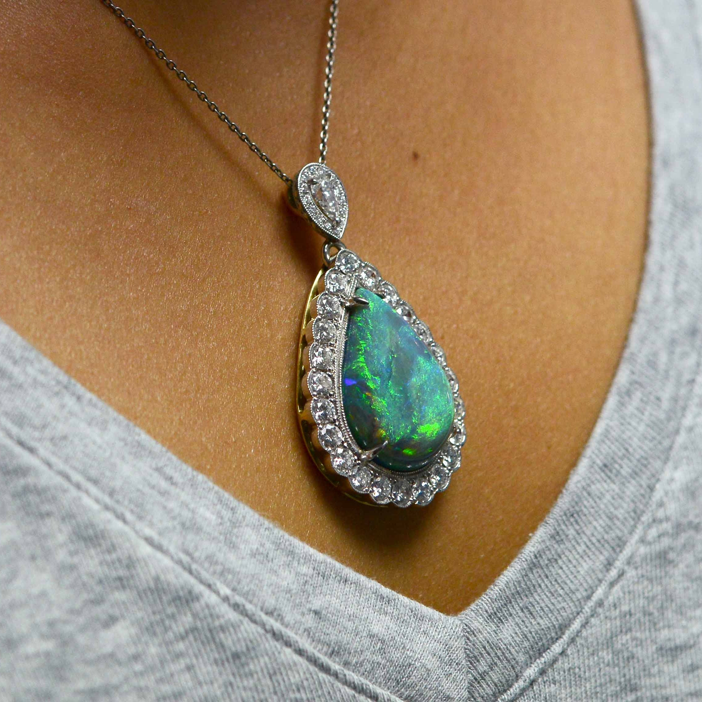 16 carats tear drop cut Australian black opal platinum pendant.