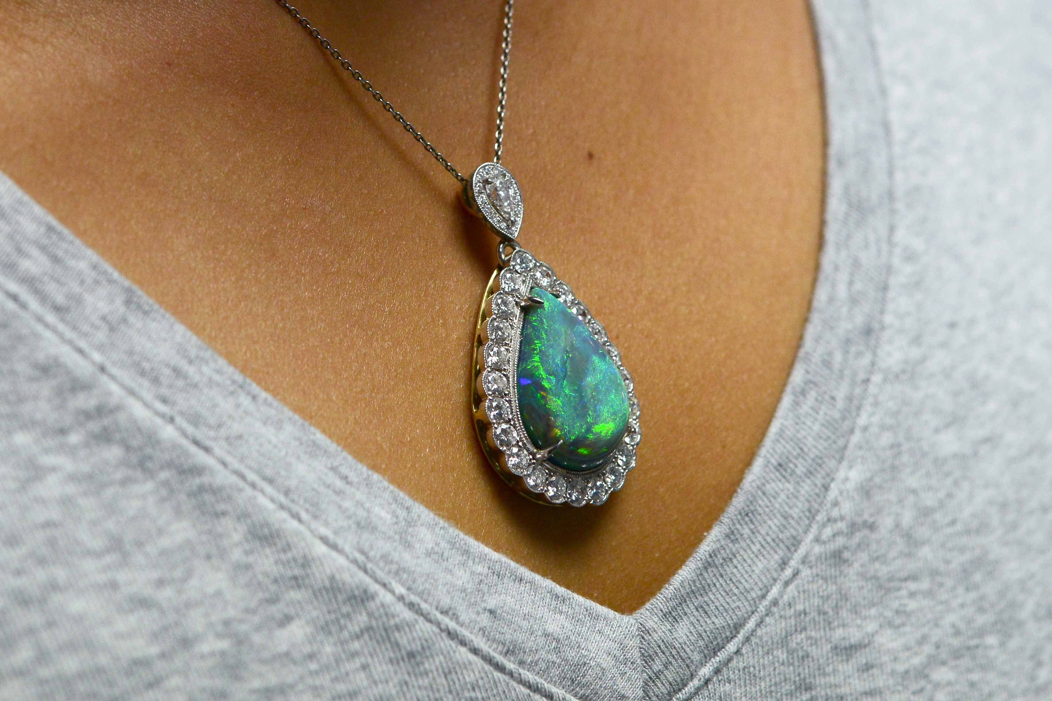 16 carats tear drop cut Australian black opal platinum pendant.