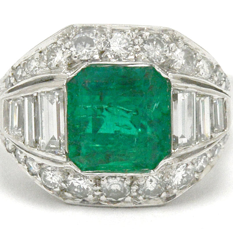 An Art Deco emerald and diamonds palladium engagement ring.