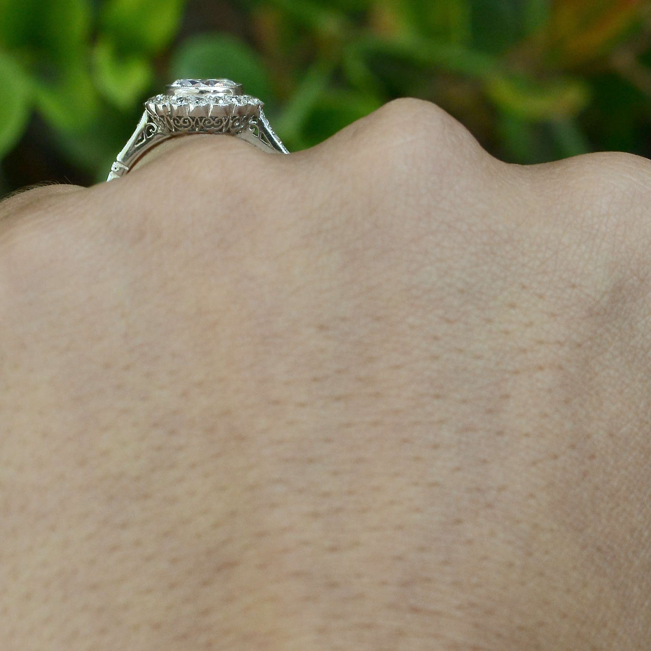 A diamond bezel set Edwardian wedding ring.