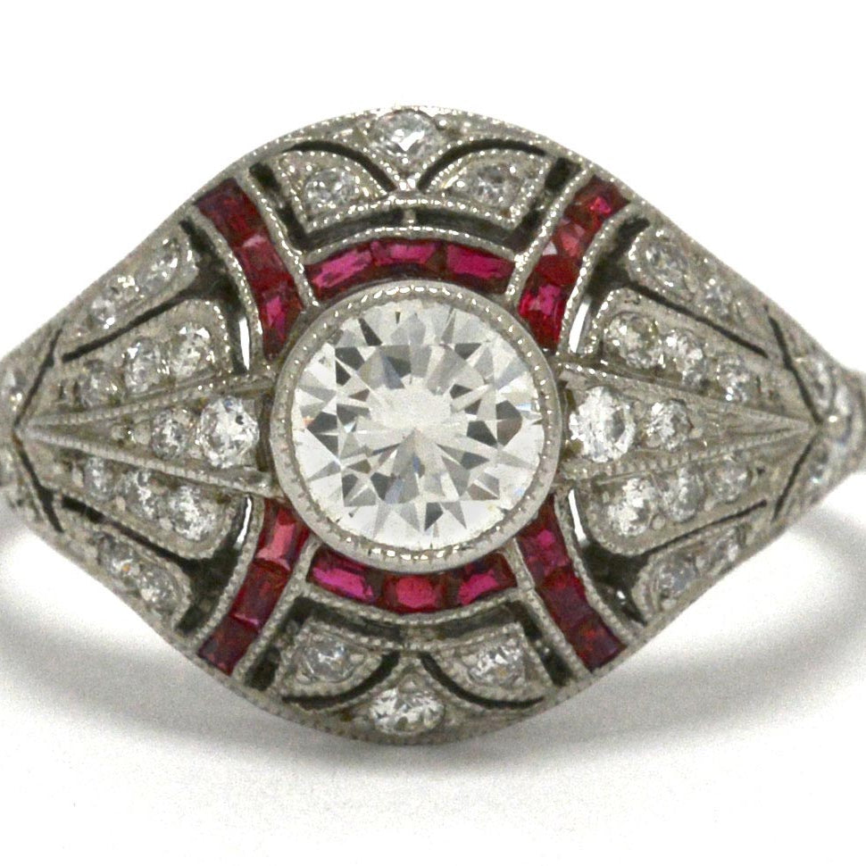 A dome style Edwardian diamonds and rubies engagement ring.