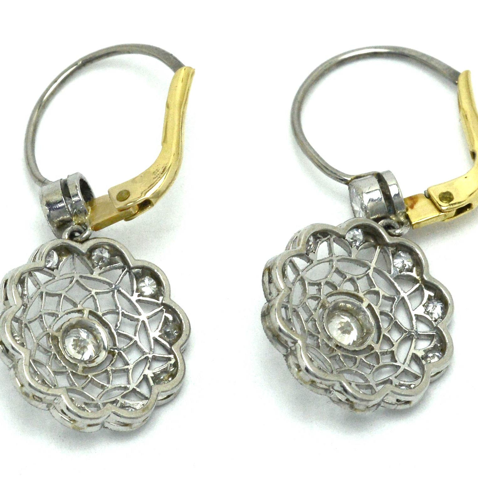 Platinum and yellow gold lever back, Edwardian diamond cluster earrings.