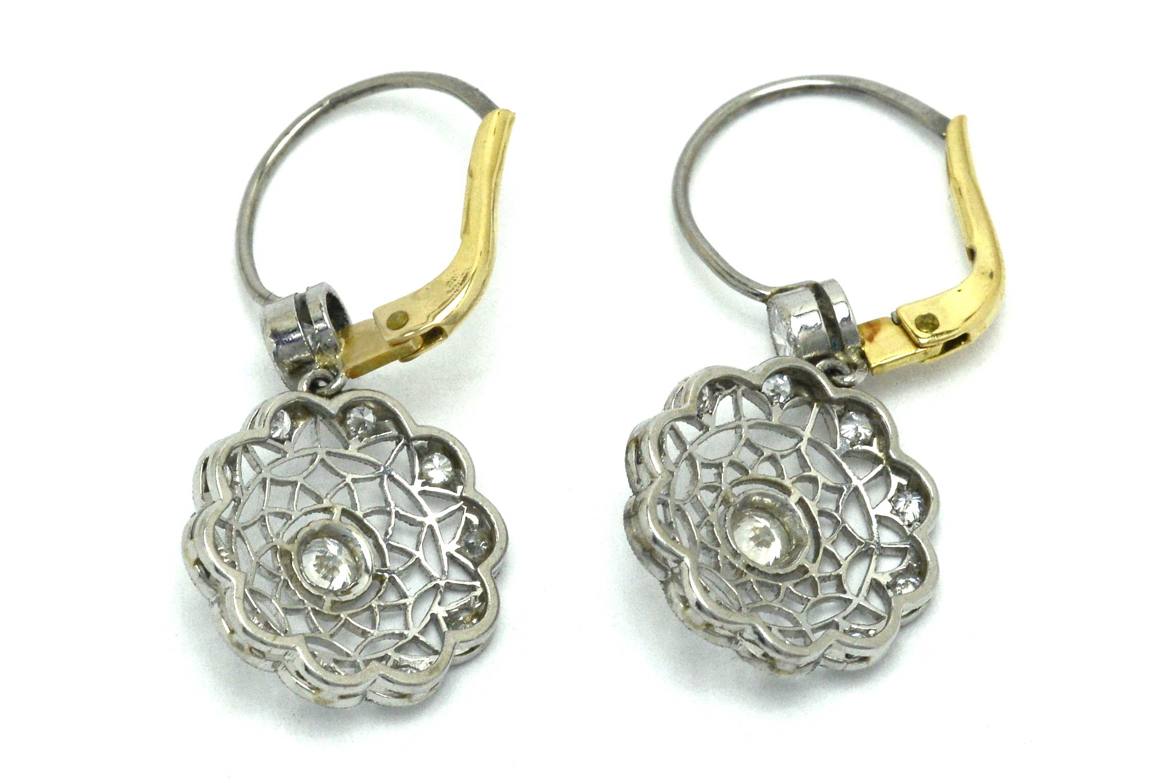 Platinum and yellow gold lever back, Edwardian diamond cluster earrings.
