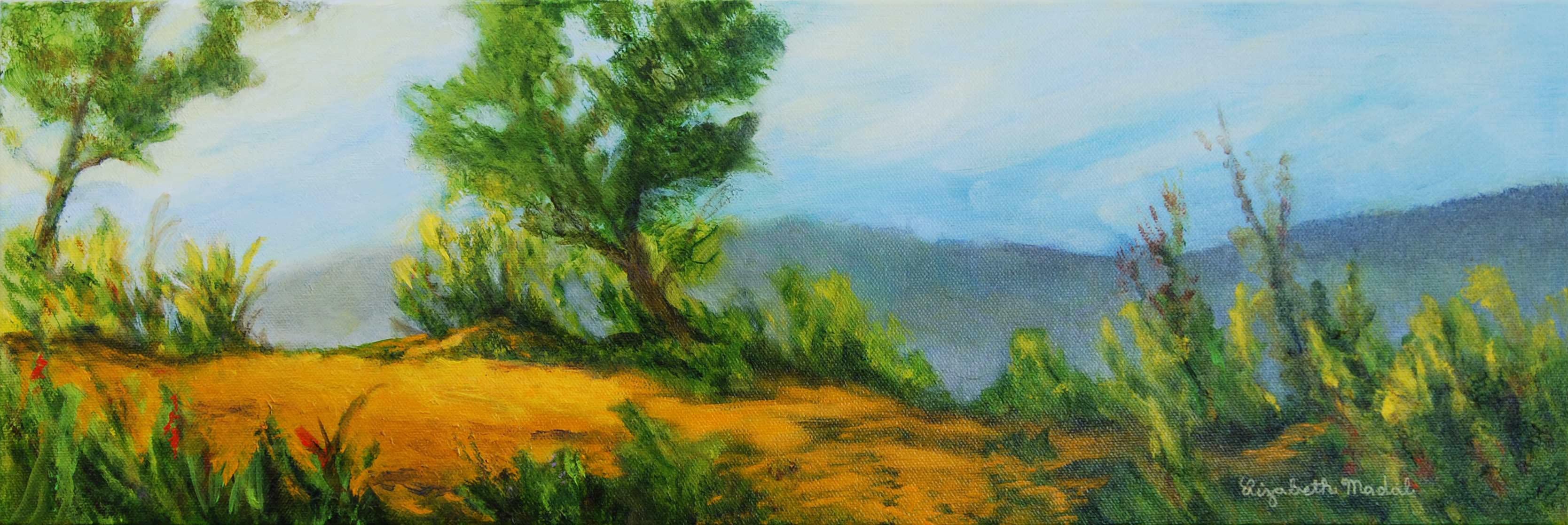 A colorful green path on the side of a mountain.