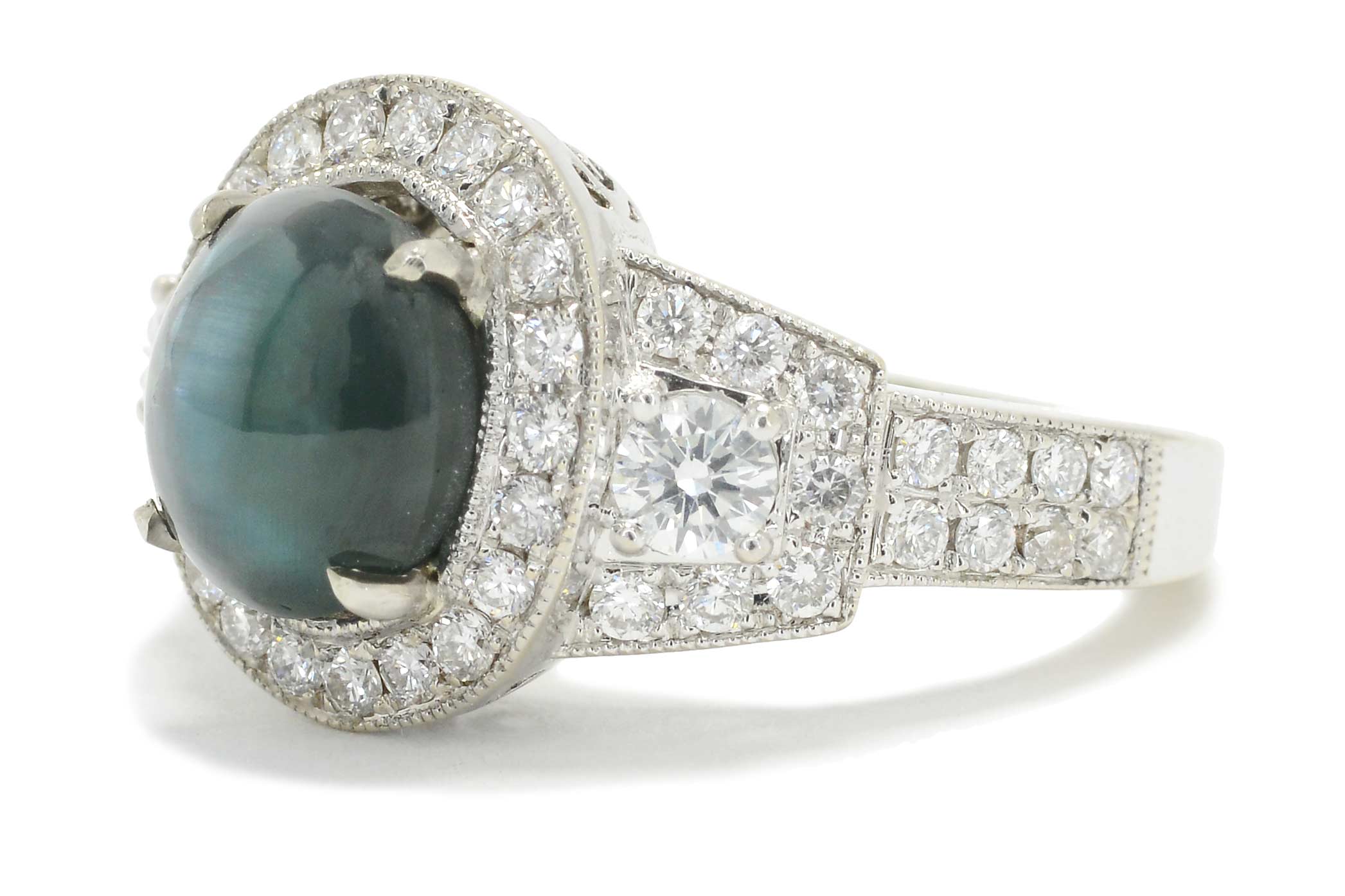 An excellent example of alexandrite, this oval cabochon cut specimen has bluish green color.