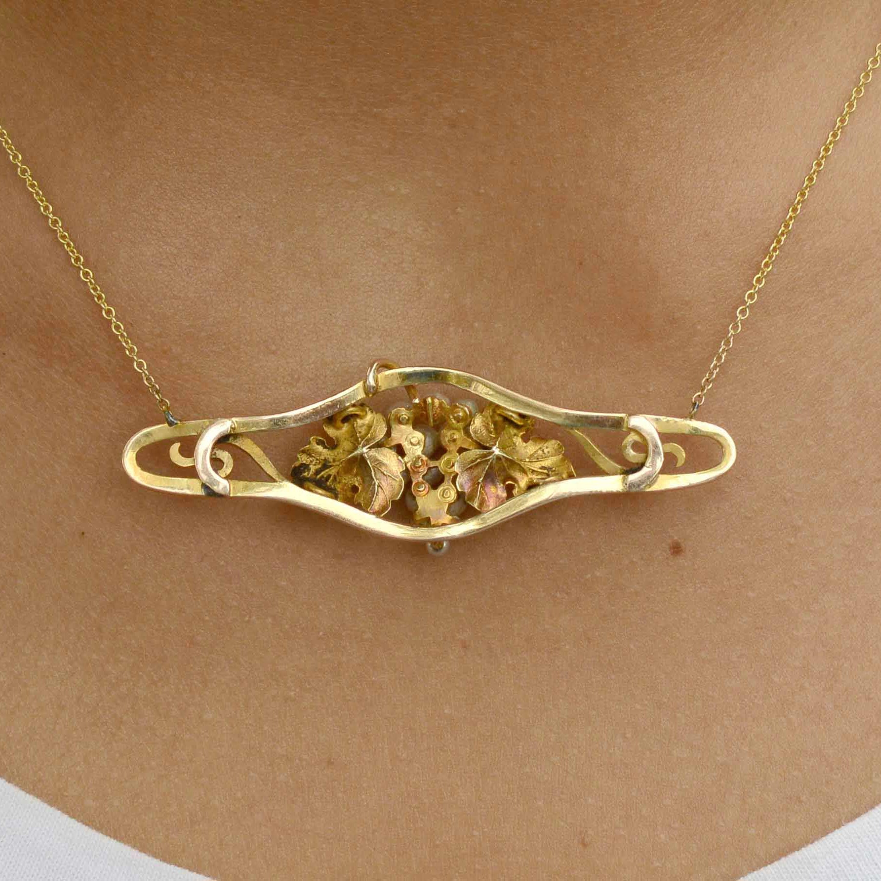 This gold and pearl grape leaf necklace shows great craftsmanship.